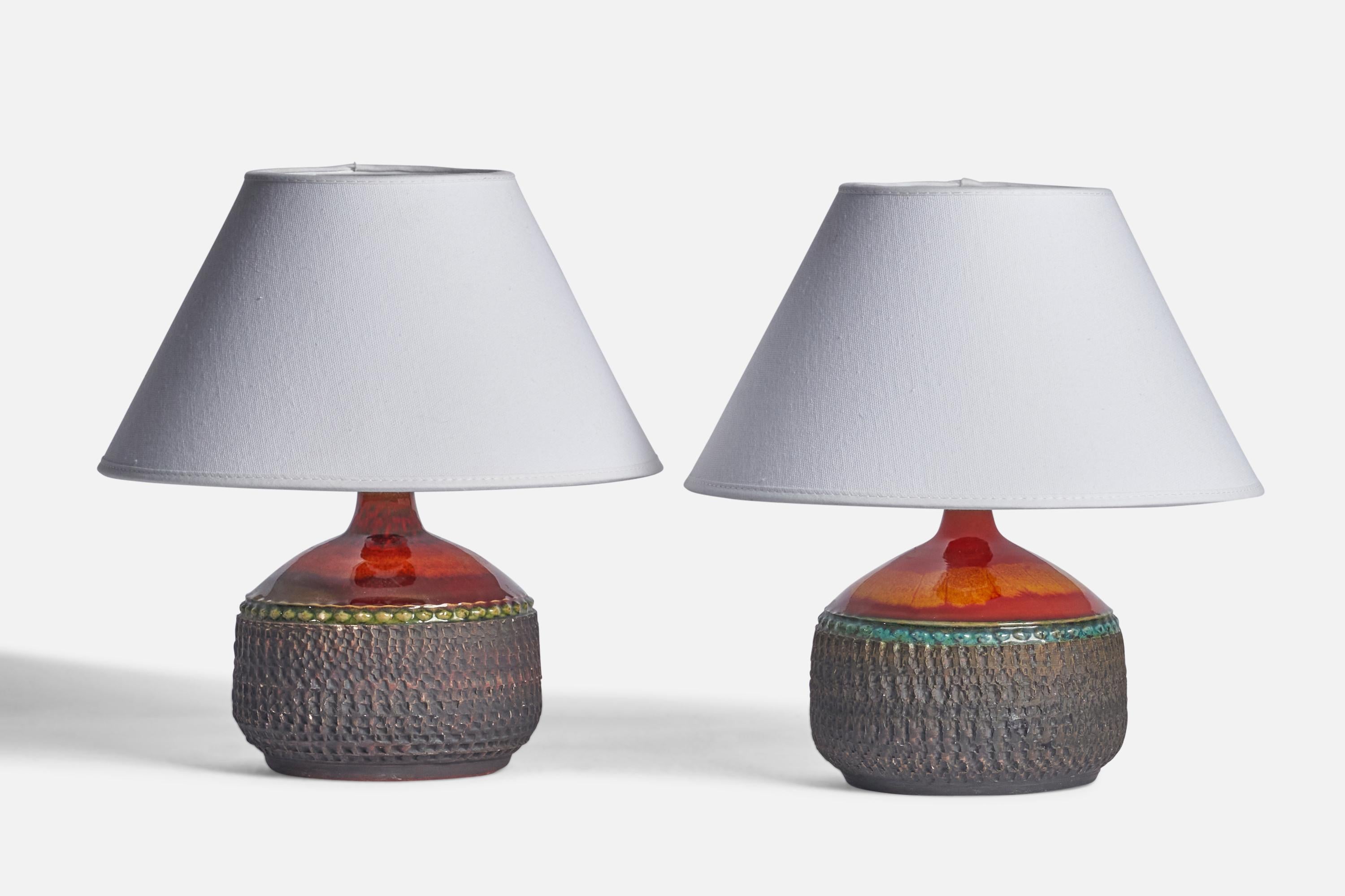 A pair of green, orange, red and grey-glazed table lamps designed and produced by Klase Höganäs, Sweden, 1960s.

Dimensions of Lamp (inches): 7.25” H x 5.25” Diameter
Dimensions of Shade (inches): 4.5” Top Diameter x 10” Bottom Diameter x