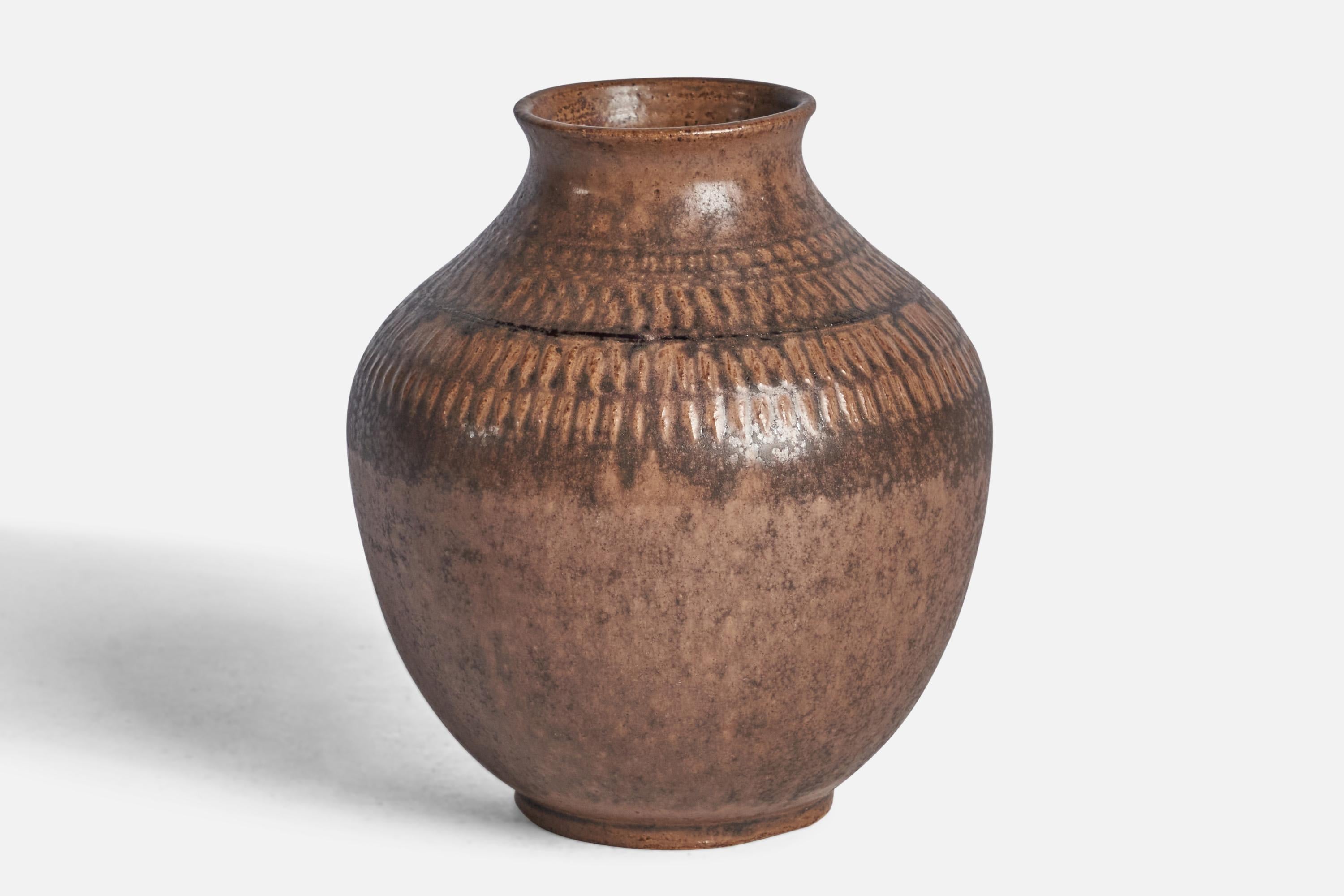 A brown-glazed incised stoneware vase designed and produced by Klase Höganäs, Sweden, 1970s.