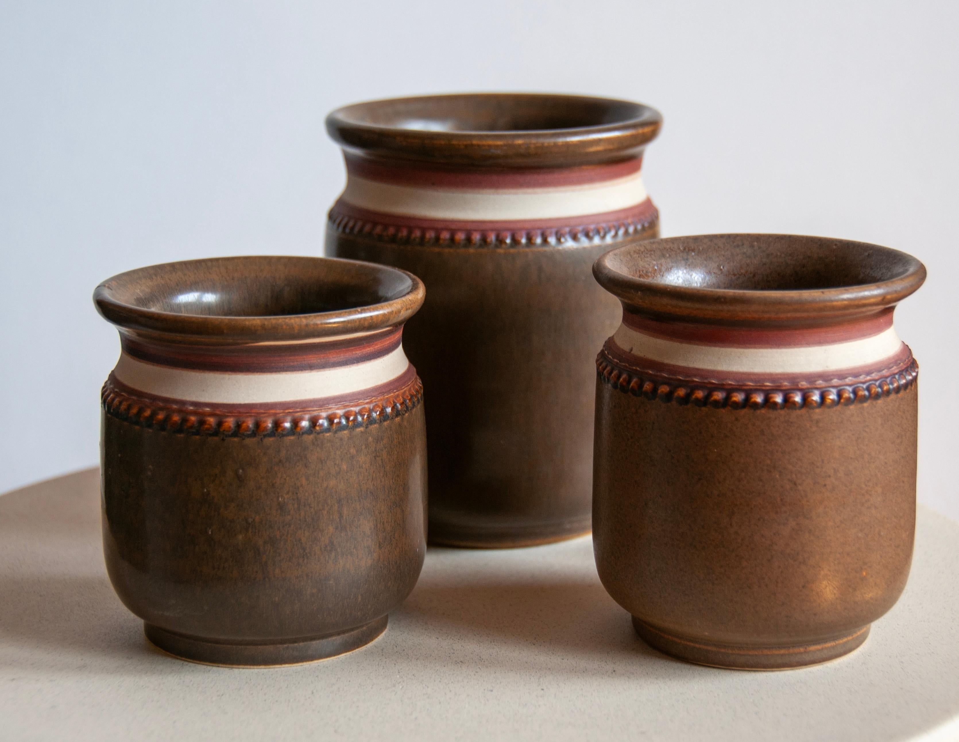 Discover Timeless Elegance: Handcrafted Ceramic Vases by Klase Keramik Höganäs

Product Description:
Elevate your space with a trio of exquisite ceramic vases, meticulously handcrafted by Klase Keramik Höganäs in the 1960s. These vases, while