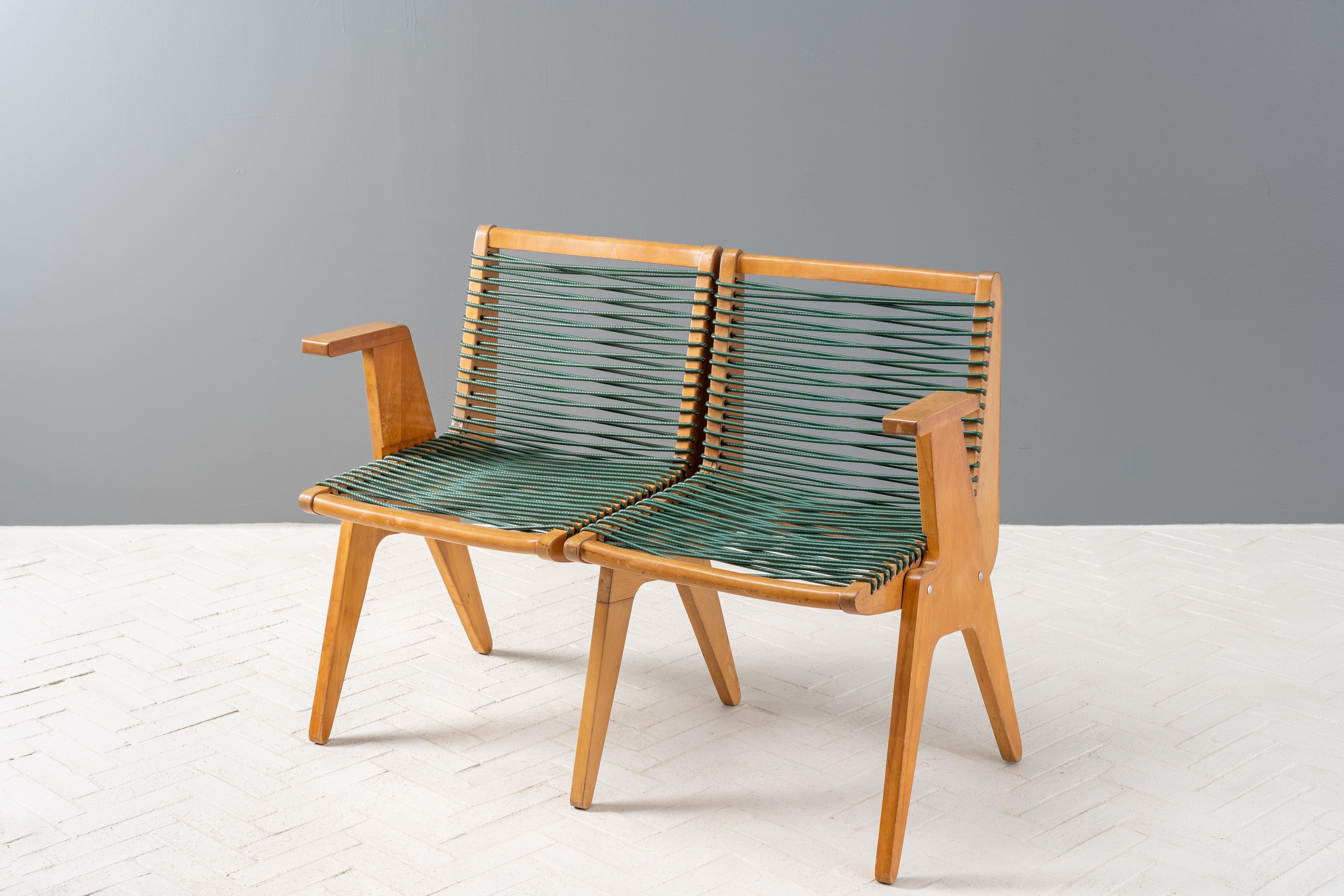 USA, ca. 1950s. An unusual 2-seat bench attributed to Klaus Grabe for Robert Kayton Associates - produced by the Kingston Manufacturing Company of Kingston, NY. Featuring an angular modular design executed in solid birch with tapered legs and