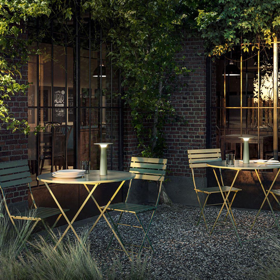 Klaus Nolting 'Lix' portable outdoor aluminum table lamp in sage for IP44de.

Founded in 1933 in East Westphalia, Germany, ID44.DE has quickly become one of the most innovative outdoor lighting companies in Europe, producing innovative pieces