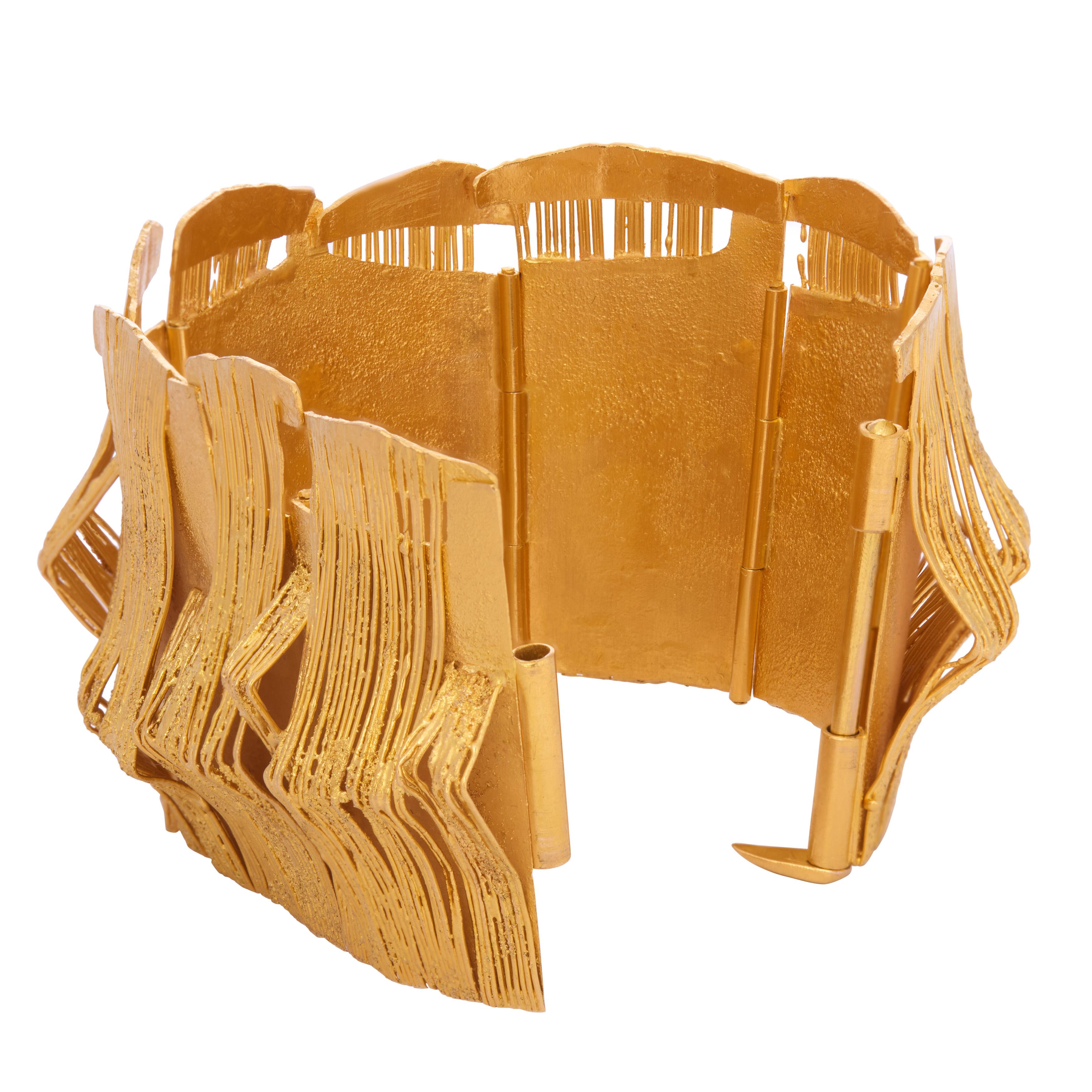 This stunning 21-karat yellow gold hinged bracelet, crafted in the 1960s by the pioneering late German goldsmith Klaus Ullrich, showcases the post-war modern jewelry design for which he is celebrated. Ullrich, known for creating functional and