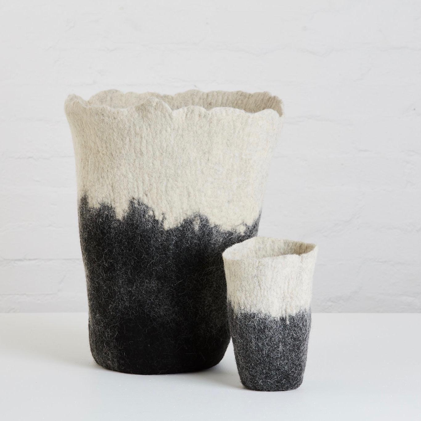 Introducing our new range of felt cushions, vases and throws. All handmade with love in Africa by a talented group of artisans. 

Our Ombre Vase is hand felted using 100% Karakul wool. Put a glass jar/vase inside and fill with flowers, a plant or