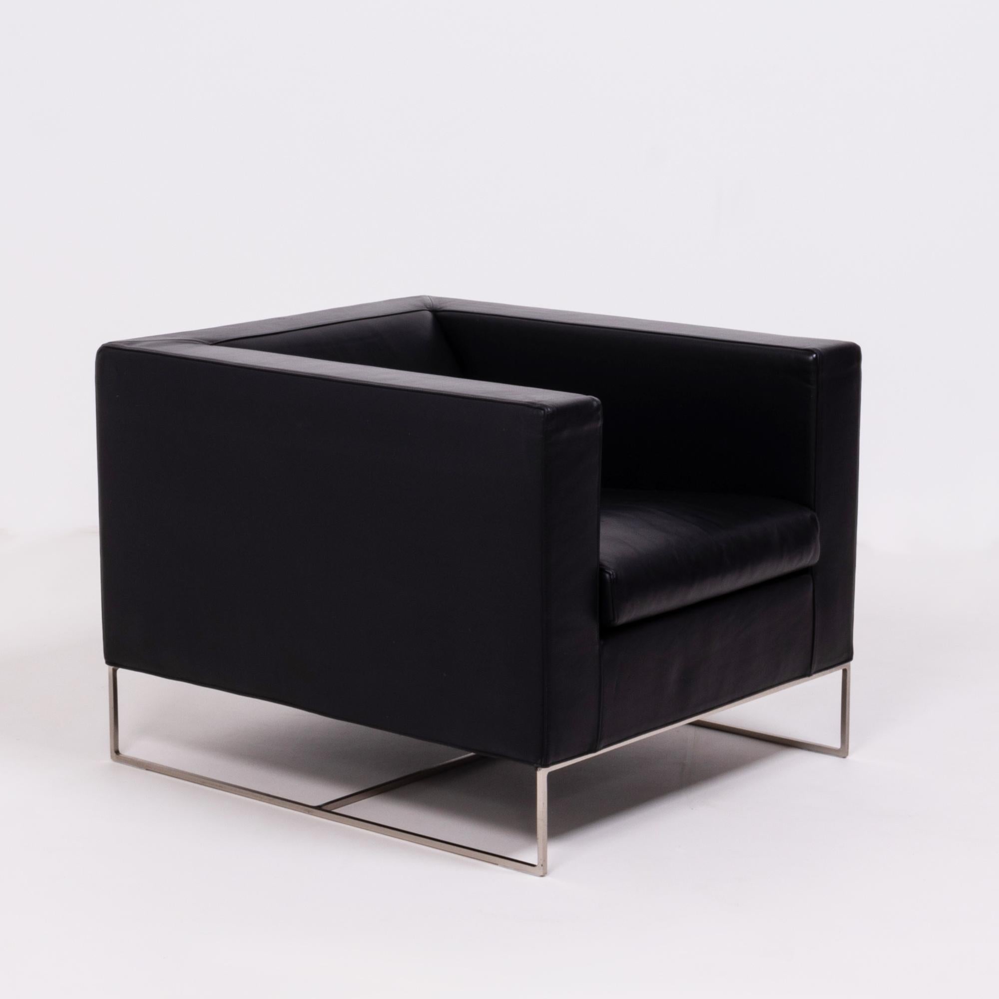 Designed by Rodolfo Dordoni for Minotti, the Klee armchair has a sleek, modern silhouette.

The chair has a bold cube-like shape, contrasted by a finer, geometric base constructed from handworked metal.

Fully upholstered in black leather, the