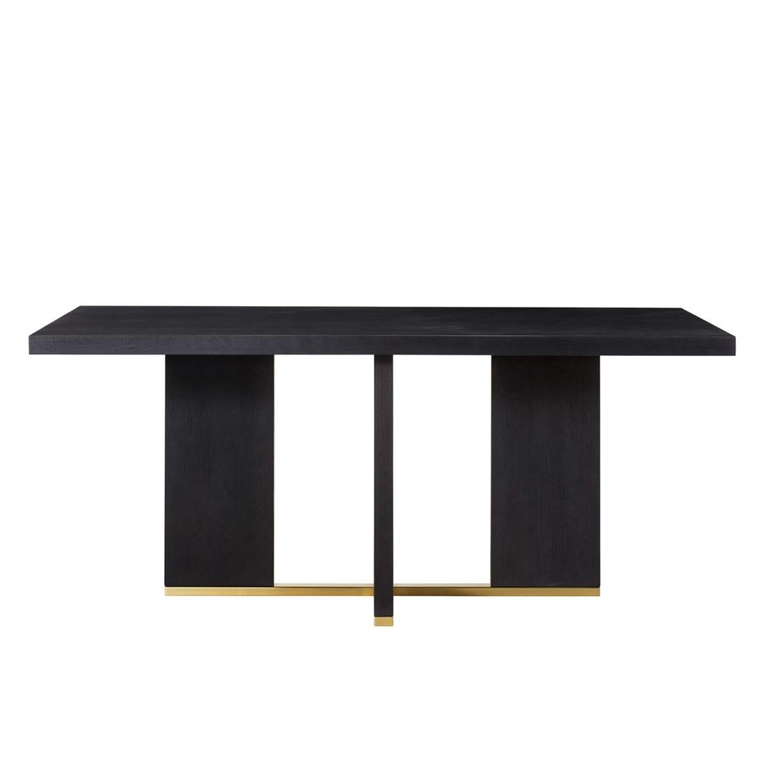 Dining table Klein with all structure in solid
poplar wood in black tinted finish and in solid
beech wood. With base in polished stainless
steel in gold finish.