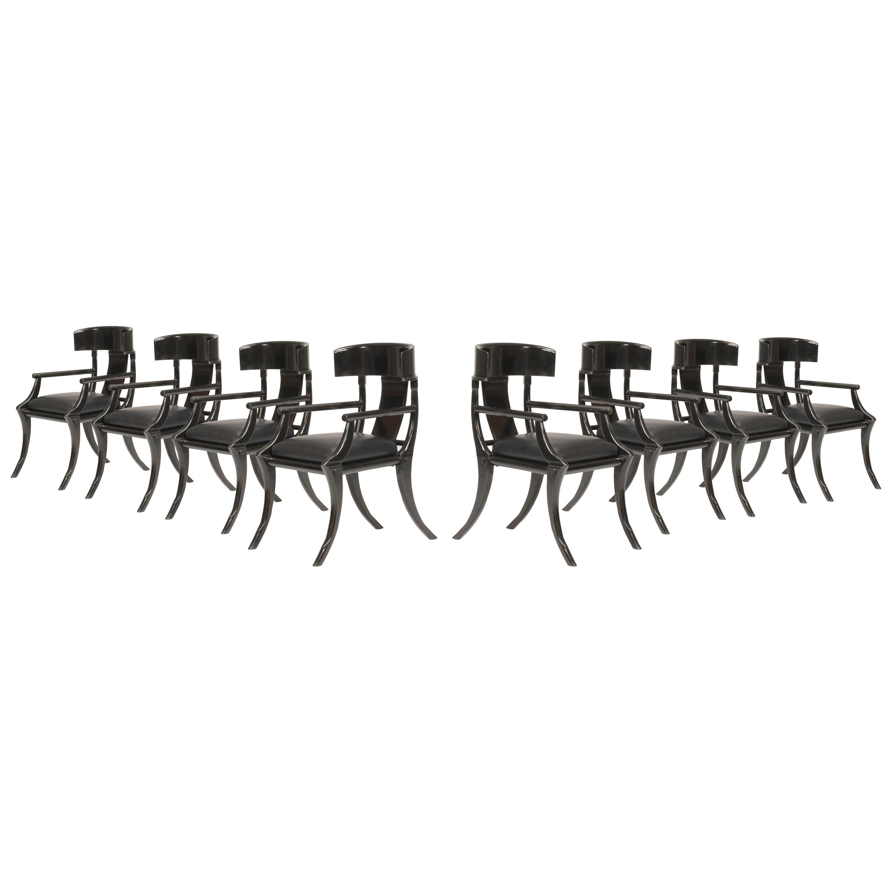 Klismos customizable armchairs with saber legs, black lacquered wood and black plain leather seats. Available in other colors and upholstery.

Walnut wood chairs with deep and large seat and back wraparound feeling backrest. These armchairs are made