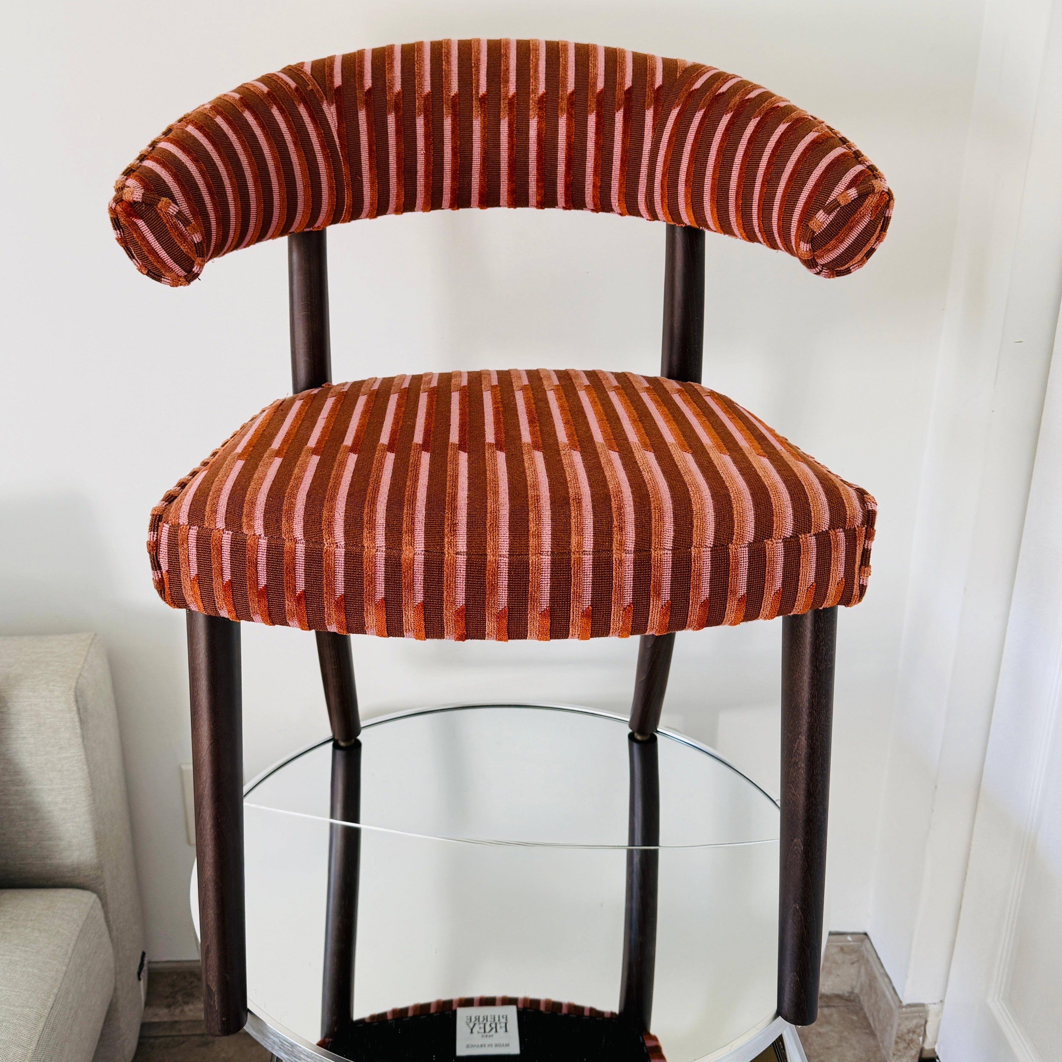 Curved back side chair or desk chair by La Maison Pierre Frey.  Upholstered in Ken Fulk's Velvet Lines featuring cut velvet in multi-colors of brown, salmon, and burnt orange.  Highly stylized chair has a Mid-Century Modern inspired design and is