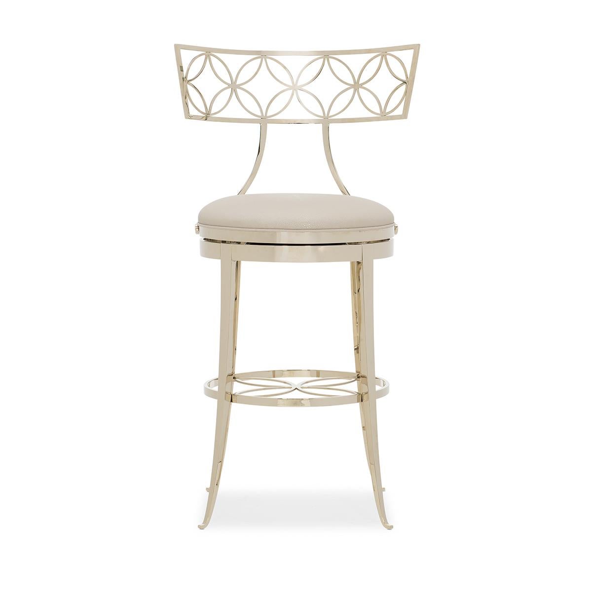 Klismos gold barstool, a plated gold finish accentuates its bold curves and elegant detailing. It boasts a Klismos shape combined with open metalwork featuring a quatrefoil pattern. A faux shagreen upholstered seat adds another layer of comfort, as
