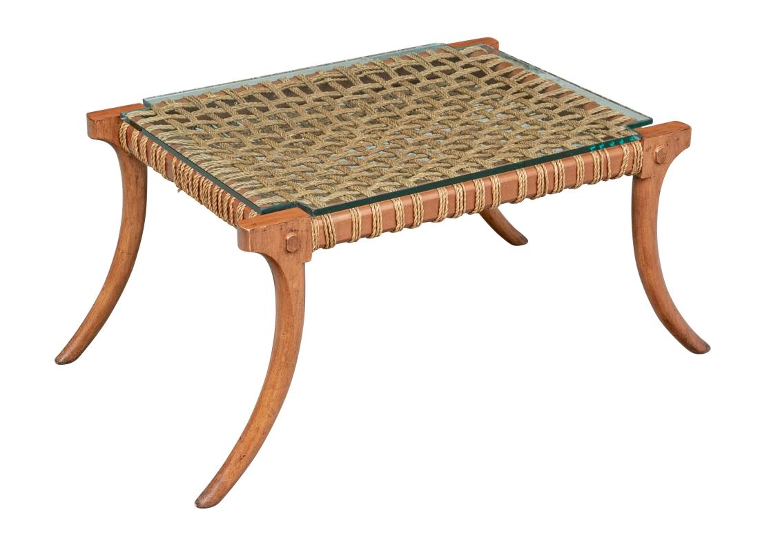 Well  made and very solid feeling Glass Top Klismos Cocktail Table with Rope Top. The Classic Robsjohn Gibbings Bench design re-interpreted as a Table with Grid Woven Rope Top having a thick glass top. Deep Amber tone wood contrasts very nicely with