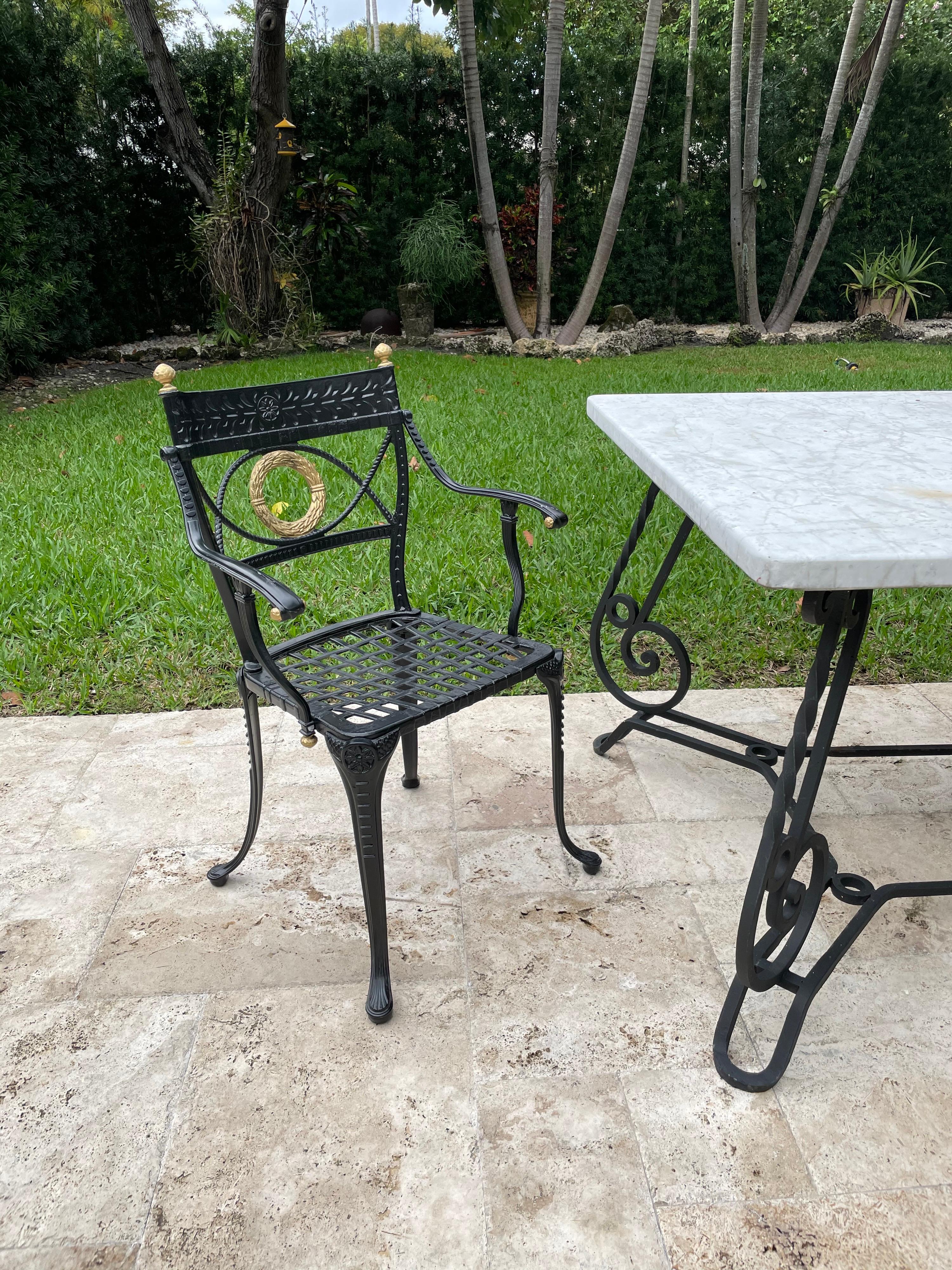 With neoclassical embellishments, these wonderful black and gold garden chairs are solid and beautiful.