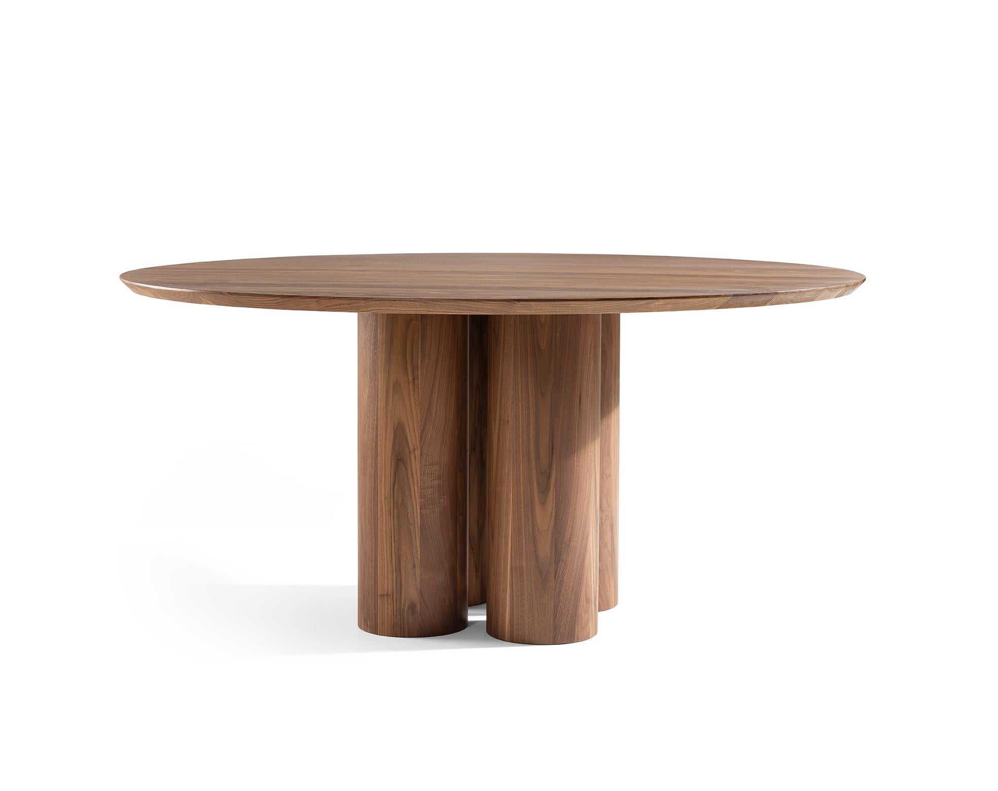 Large, round, tough and of course completely massive in solid American walnut. A beautiful round table with 3 or 4 heavy, round legs. In the 'small' size of 110cm diameter with 3 legs and in the large size of 220cm diameter with 4 legs. The tapered