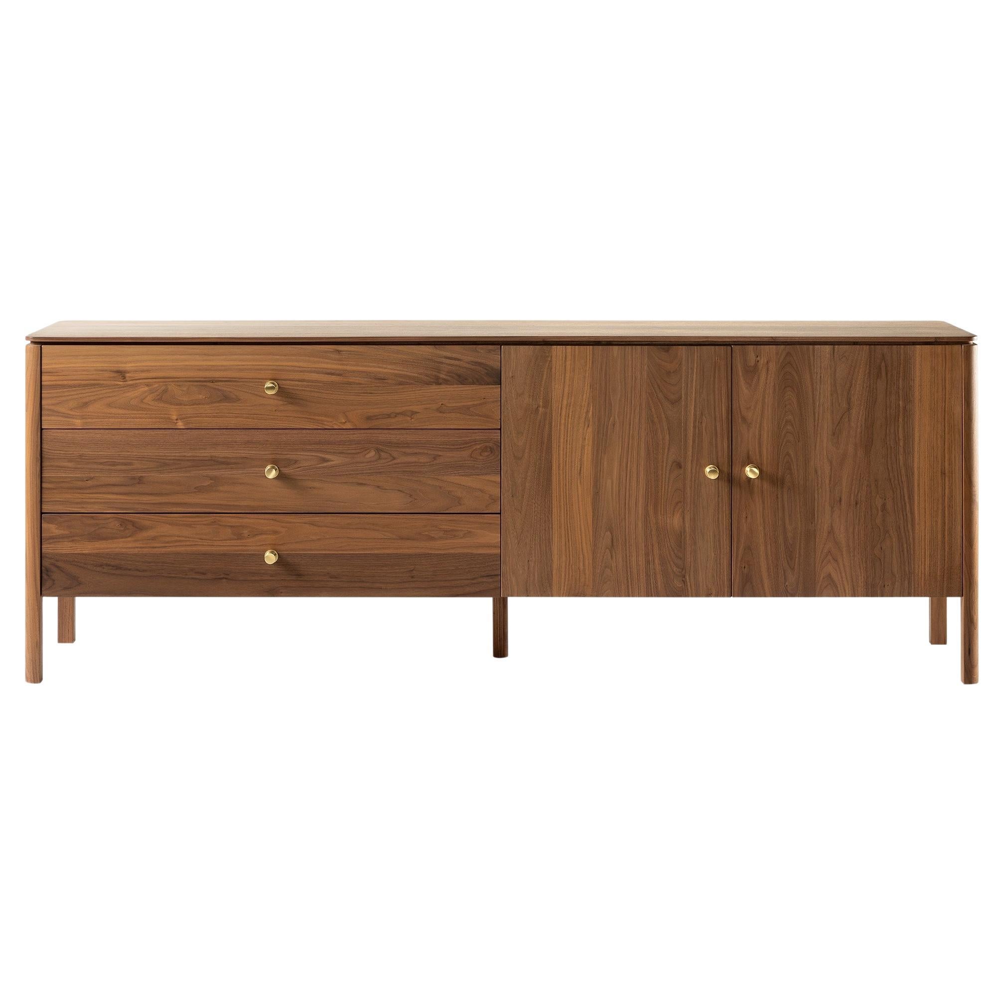 This beautiful sideboard in solid oiled walnut is an enrichment for any interior and a future heirloom. This version shown is 220cm wide, 80cm high, 48cm deep and has 2 doors and 3 drawers. Beautiful solid brass knobs taking care of the finishing