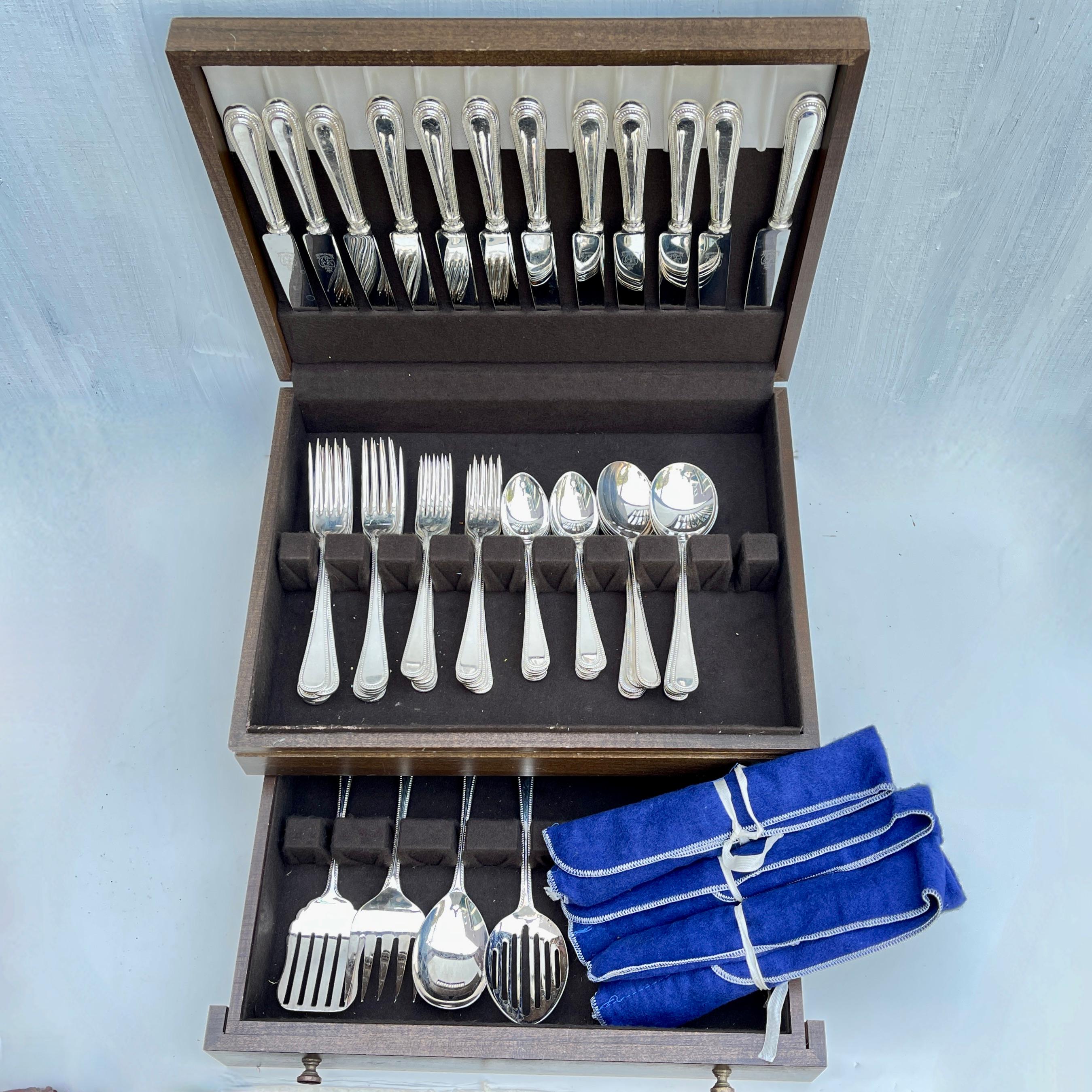 A 76 Piece Boxed set of EPNS, silver plated flatware in the Bead pattern, Kirk & Matz, Sheffield, England – circa 1960s.

Kirk & Matz Ltd. was an American cutlery importer with Sheffield links. Boxed sets of high quality, plated cutlery were a