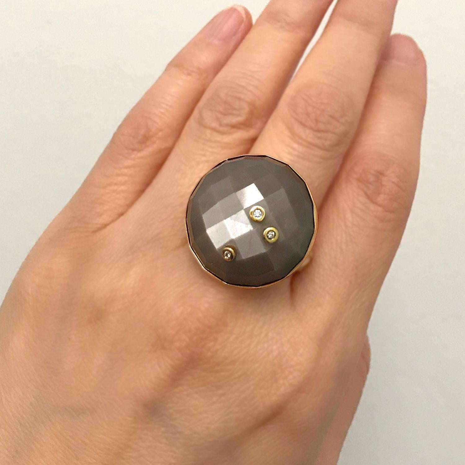 The contemporary Starry Moon Ring is handmade by K.Mita from 18 Karat Yellow Gold and Sterling Silver. It features a large 49.1 Carat faceted Chocolate Moonstone that is 24mm across at its widest point. Three diamonds (total weight 0.028 Carats) are