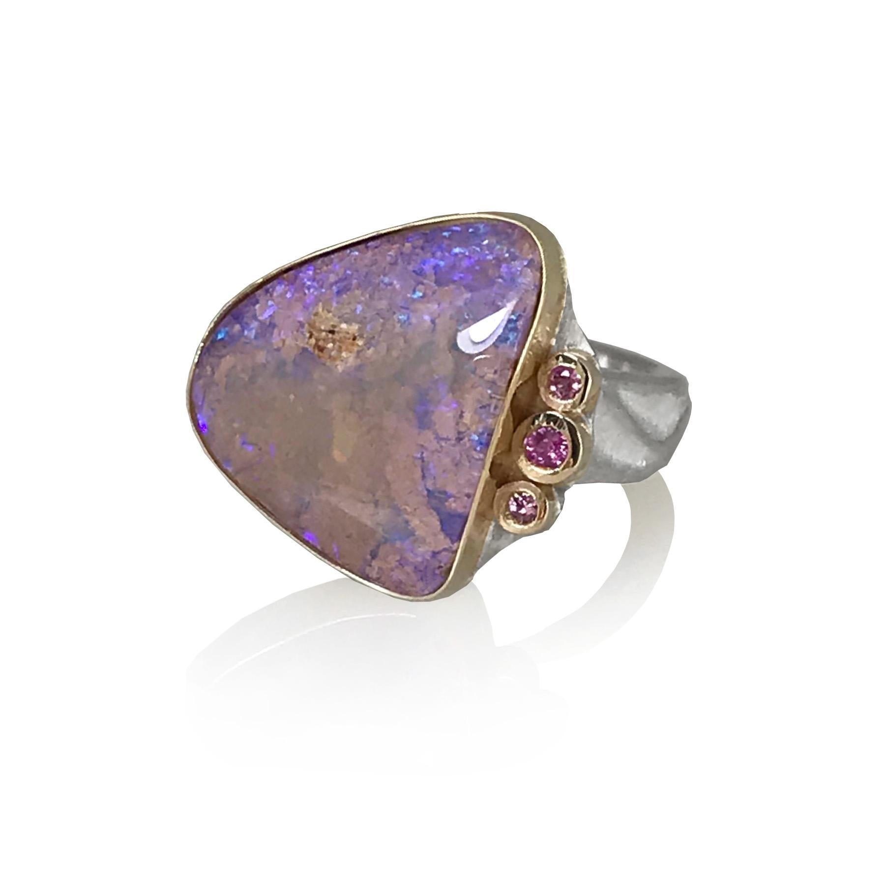 Named after the famous pink lakes of Coloradas, Mexico, K.Mita's Coloradas Ring features a 6.45 Carat Pink Boulder Opal with multiple layers of color. Staring into the ring is like staring into the depths of the ocean. The modern ring, which has a