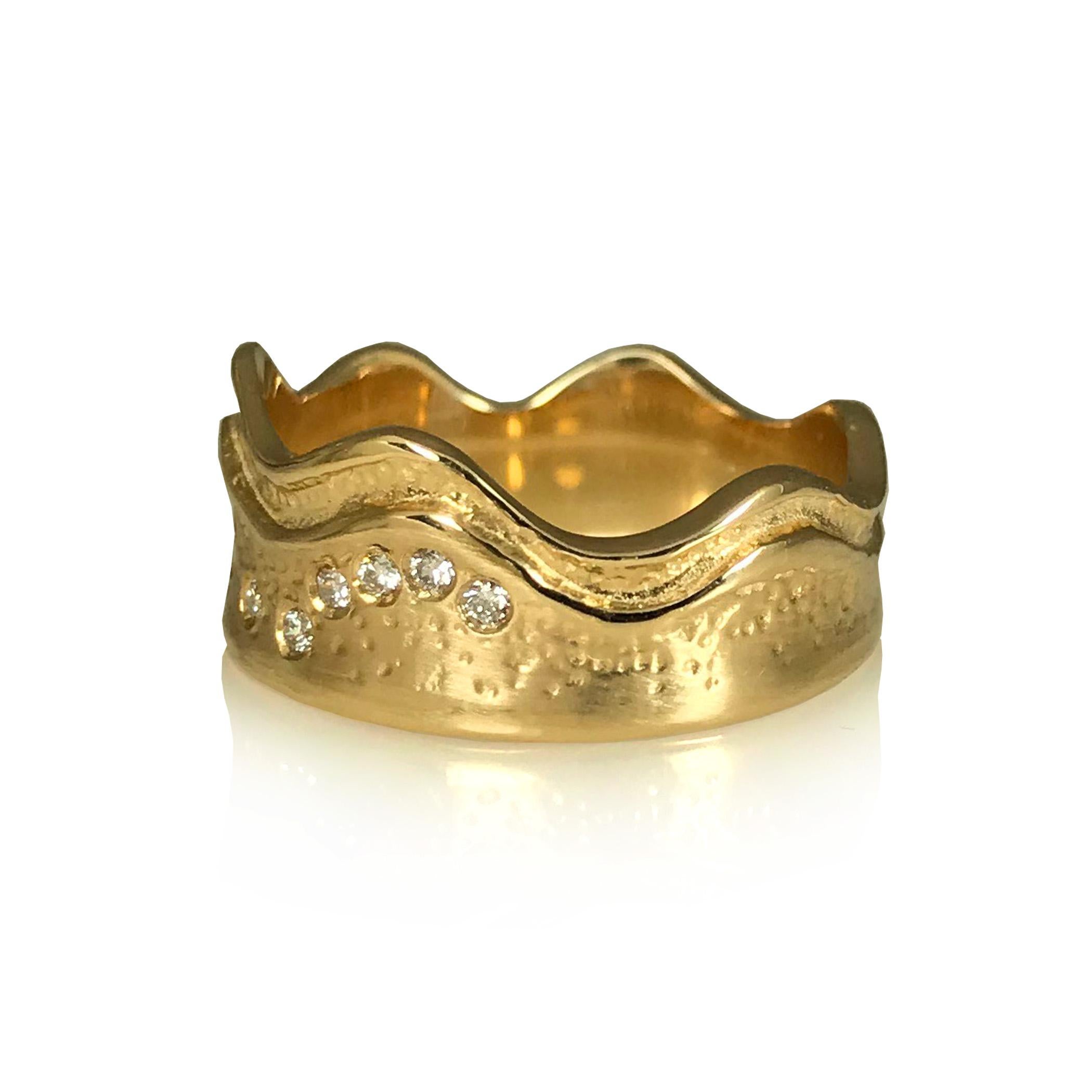 K.Mita's Tidal Ring is shaped like a wave running along the sandy shorline that rises and falls with the tides. It is handmade from 14K Yellow Gold and varies in width from 5.0 - 9.0mm. Sprinkled along the sandy shore are 0.07ct of diamonds. 
Please
