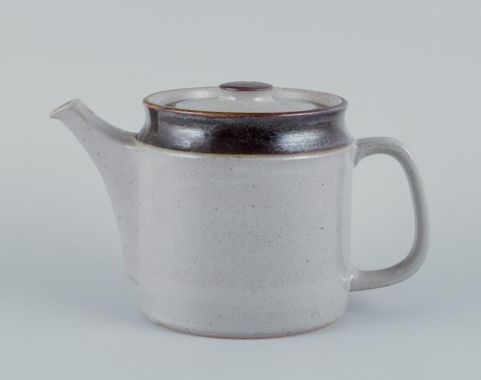 Knabstrup, Denmark.
Stoneware teapot with gray and brown glaze tones.
From the 1970s.
Perfect condition.
Marked.
Dimensions: Height 14.0 cm x Diameter 22.5 cm (including handle and spout).