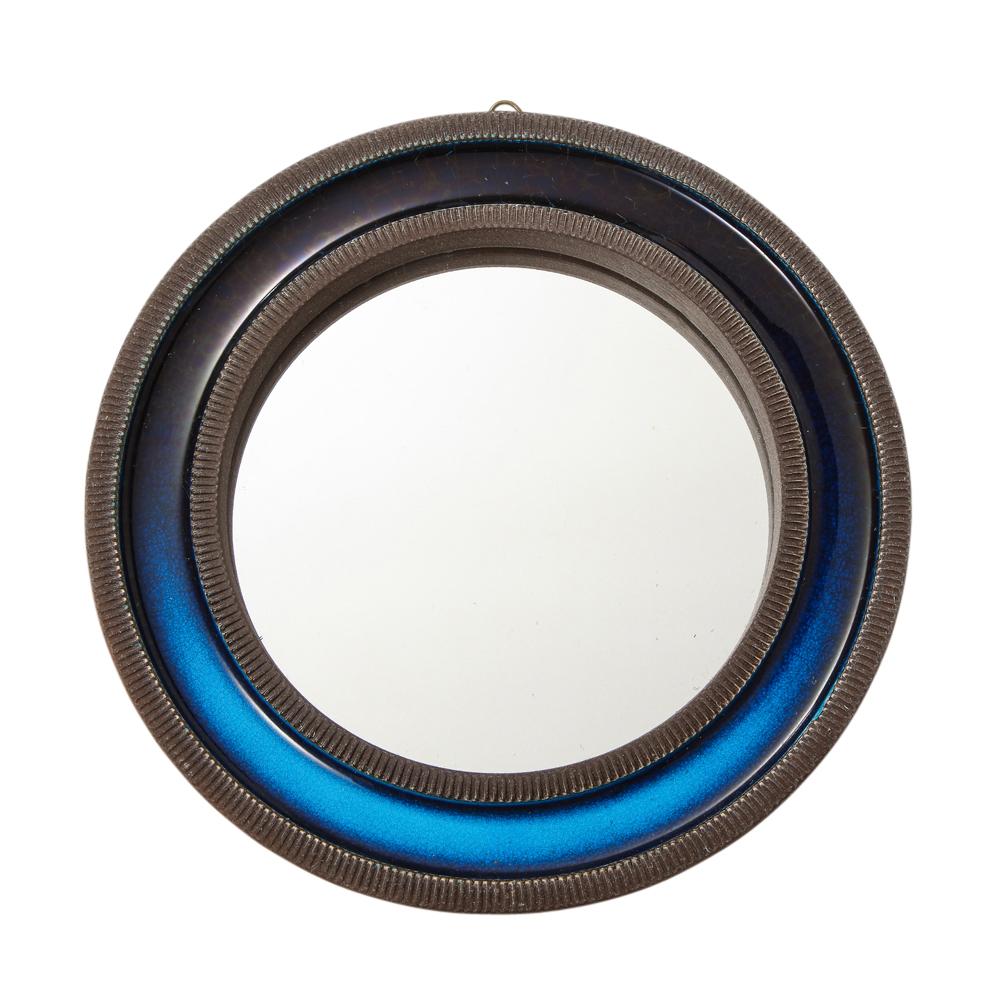 Knabstrup mirror, ceramic, blue, signed. Petite ceramic mirror with alternating rings of texture and color - smooth dark blue glaze and ribbed brown glaze. The back is covered with a mesh canvas and stamped Knabstrup on lower edge center (photo 12).