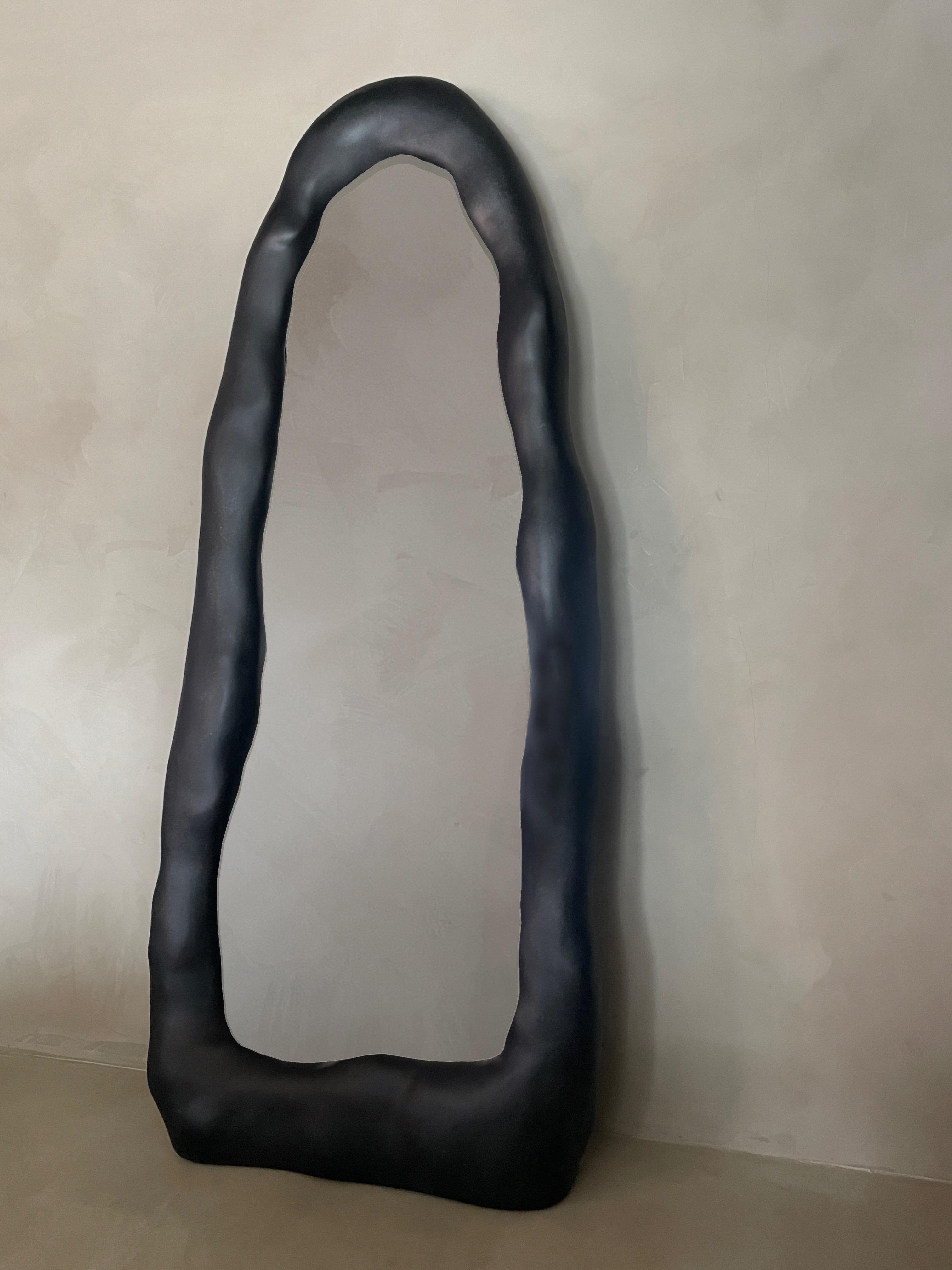 Black Knead Mirror by Karstudio
Materials: Fiberglass
Dimensions: W 80 x D 22 x H 193 cm

Knead mirror preserves the handmade traces of clay-kneading, and the hand-polished
texture captures the aesthetic and emotion of creation. The mirror is