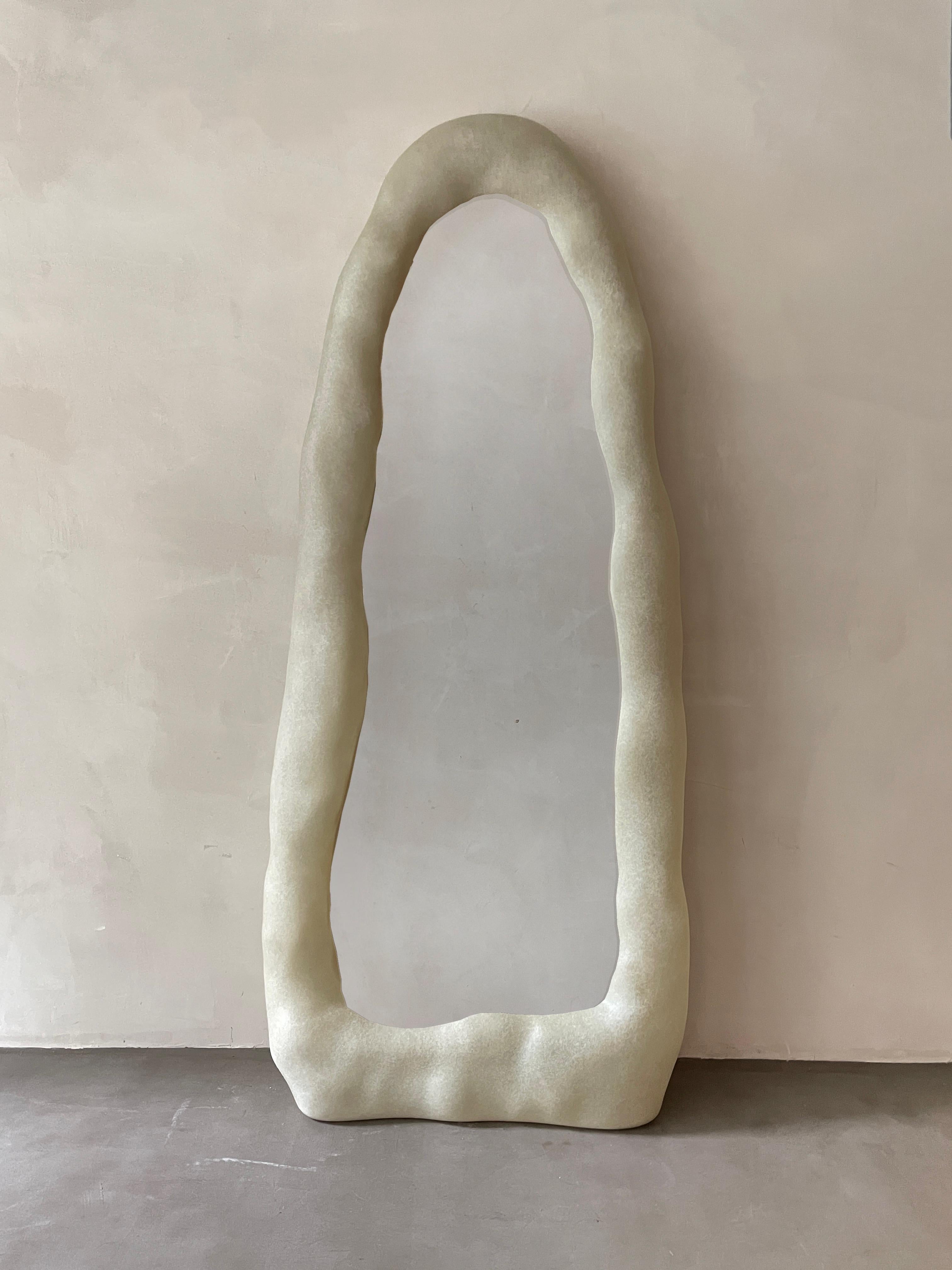 Knead mirror by kar
Materials: Fiberglass.
Dimensions: W 80 x D 22 x H 193 cm.

Knead mirror preserves the handmade traces of clay-kneading, and the hand-polished
texture captures the aesthetic and emotion of creation. The mirror is narrowed from
