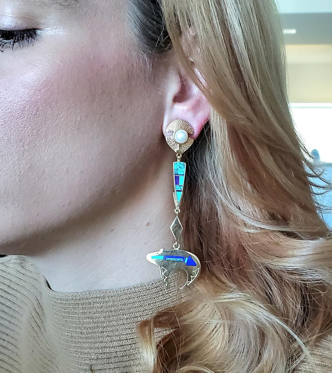 Dangle Drop Earrings designed by Ray Tracey & Knifewing Segura.

Gorgeous colorful pair of Native American (Southwestern) style dangle drop earrings with bears, designed by the Apache goldsmith Knifewing Segura and the Navajo Ray Tracey. The unusual
