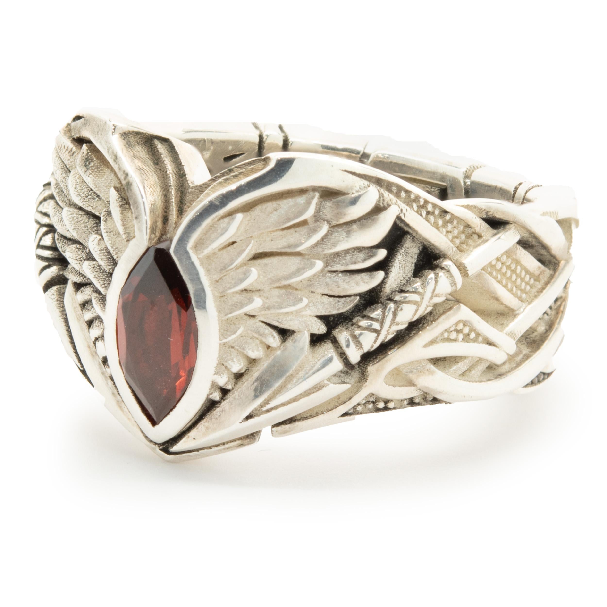 Designer: Knight Rider
Material: sterling silver
Garnet: 1 marquise cut
Measurement: ring top measures 14mm wide
Size: 7.25
Weight: 12.74 grams