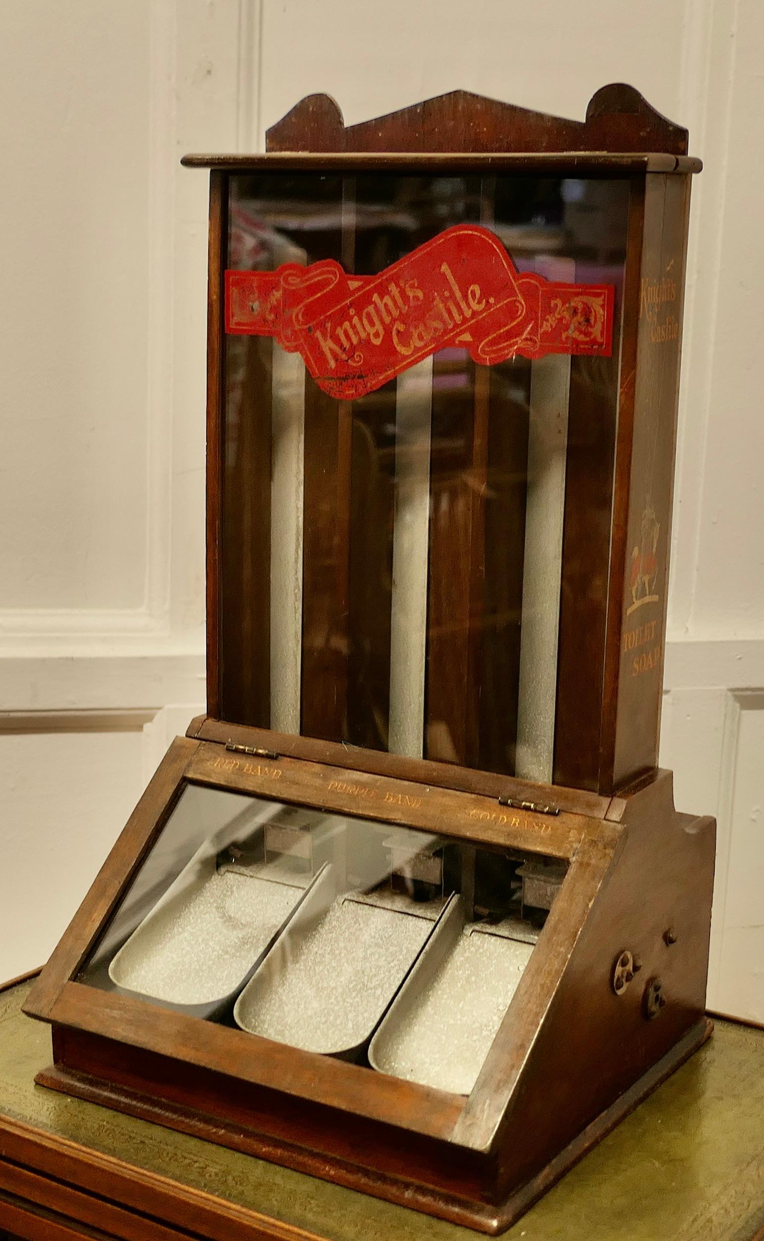 Knight’s Castile Chemist Shop Display Soap Dispensing Cabinet

This is a very rare piece, the upper glazed section holds 3 different soaps (Red Band, Purple Band and Gold Band) which each drop down to a hinged dispenser at the bottom
The cabinet is