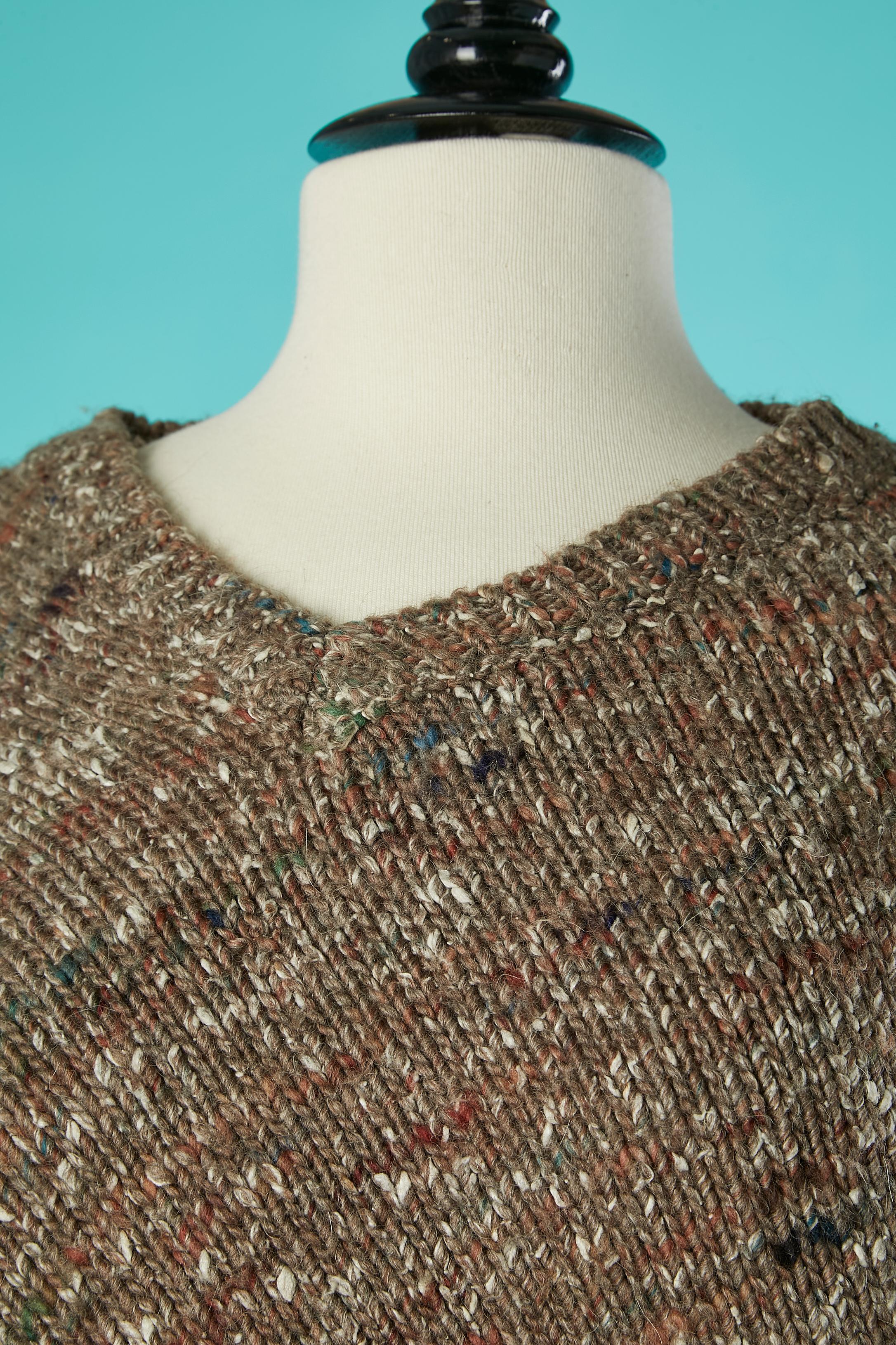 Knit mini-dress with wrap skirt. Wool composition: 65% wool, 20% alpaca, 15% silk. 
SIZE 38 / M 