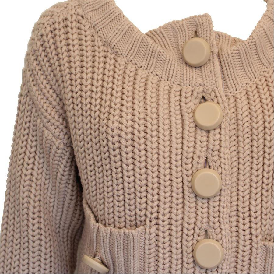 100% Wool Beige color Tricot work Two pockets Length from shoulder cm 40 (15.7 inches)
