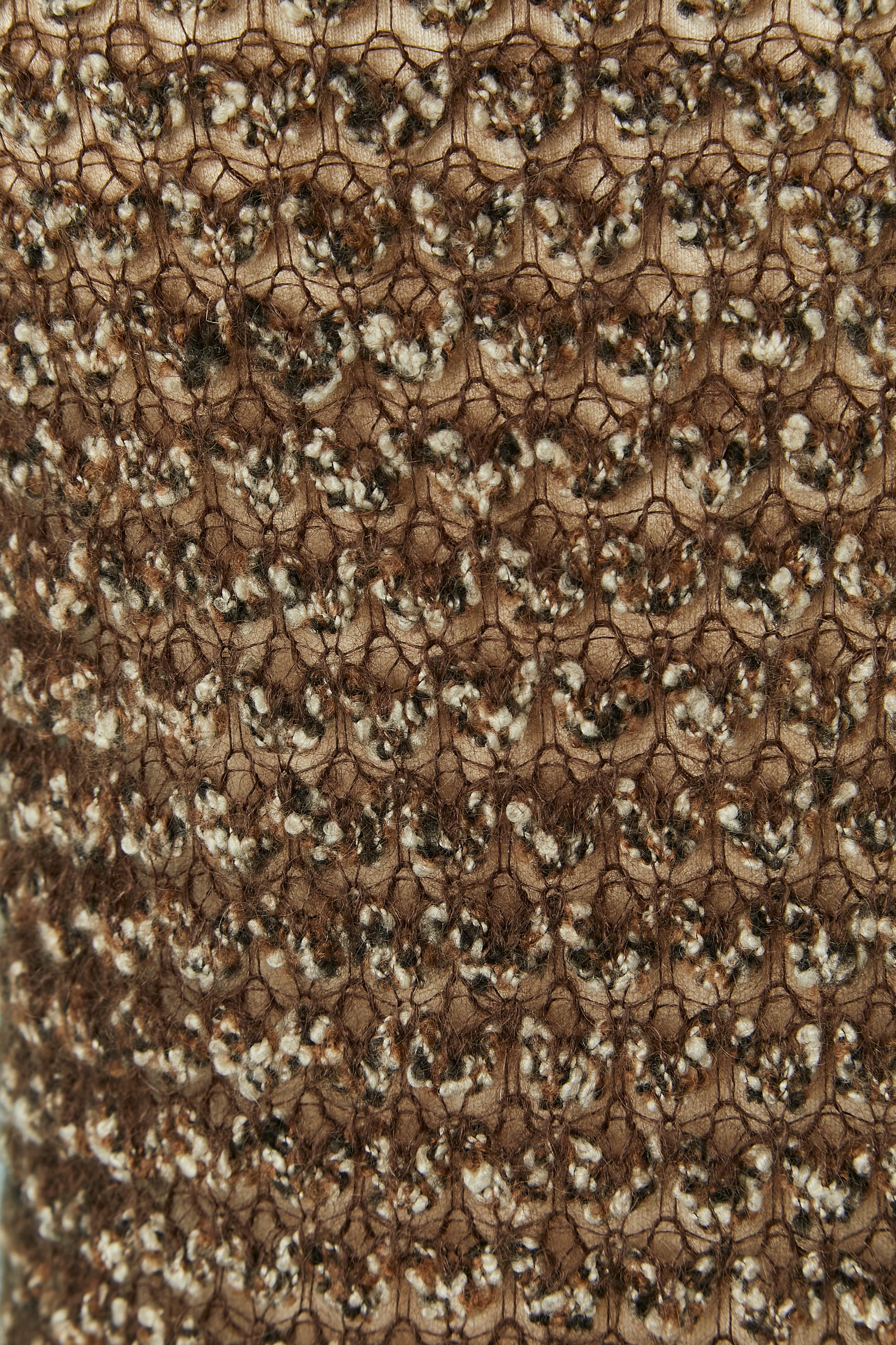 Knit short sleeve sweater. Knit composition: 35% mohair, 35% wool, 23% nylon, 7% silk. 
SIZE 42( It) M 