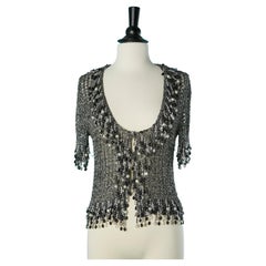 Cardigan en maille lurex argentée avec bord perlé et chaînes Loris Azzaro Paris