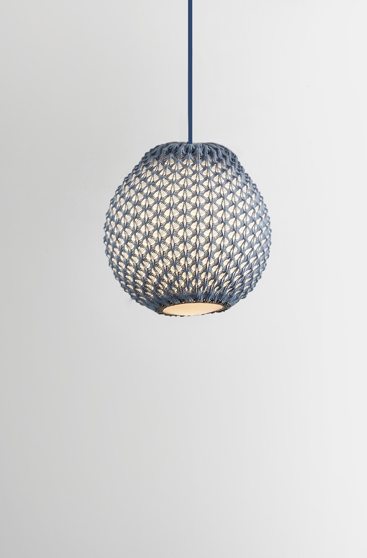 The Knitted Falling Pendant blends craftsmanship with modern lighting. Available in three sizes (12