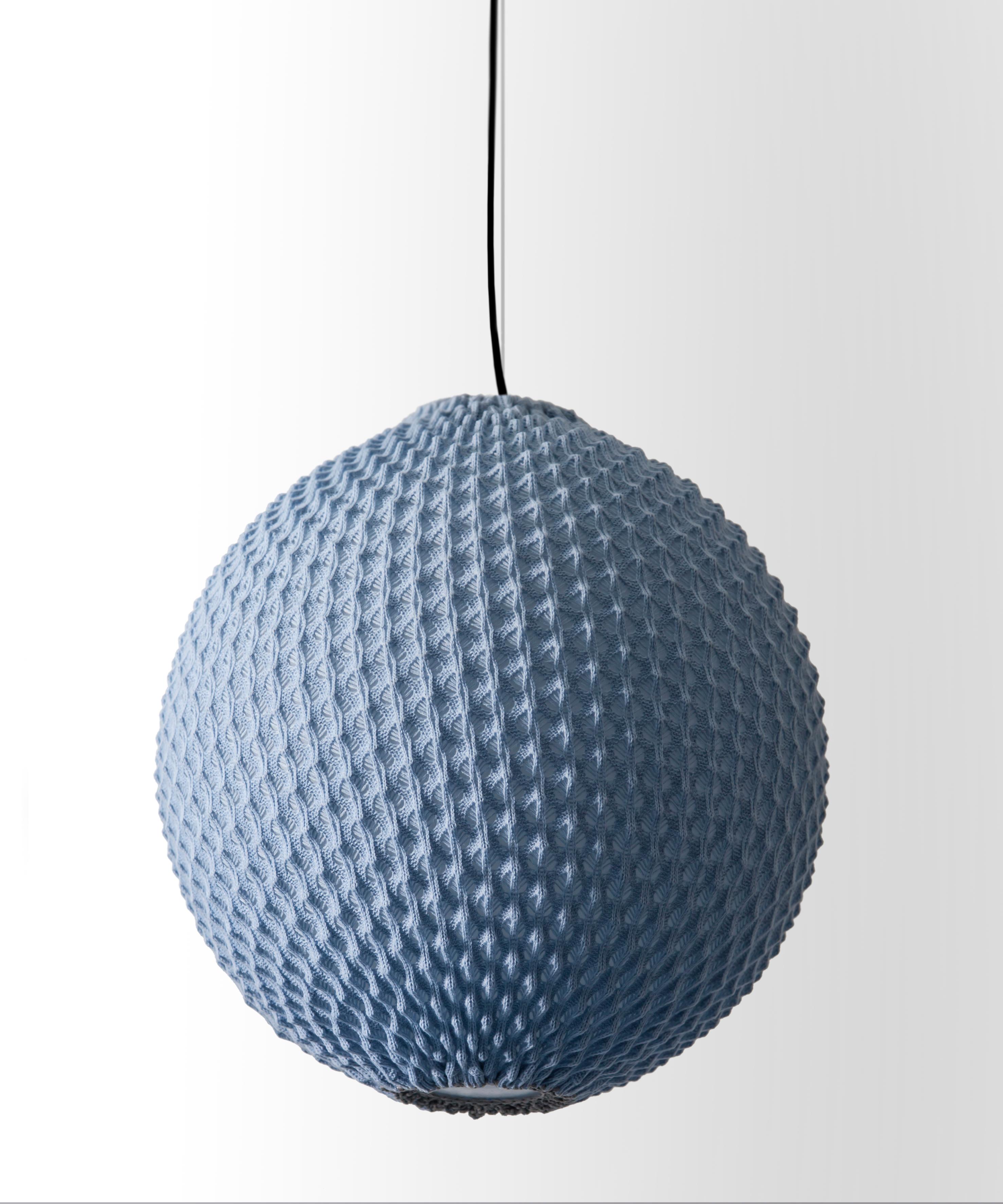 The Knitted lighting is an award-winning collection 

series of lightings that combines technology with tradition 
Knitting acrylic threads in fixed patterns with wool crochet, creates a three-dimensional sheet of fabric 
which serves as a lighting