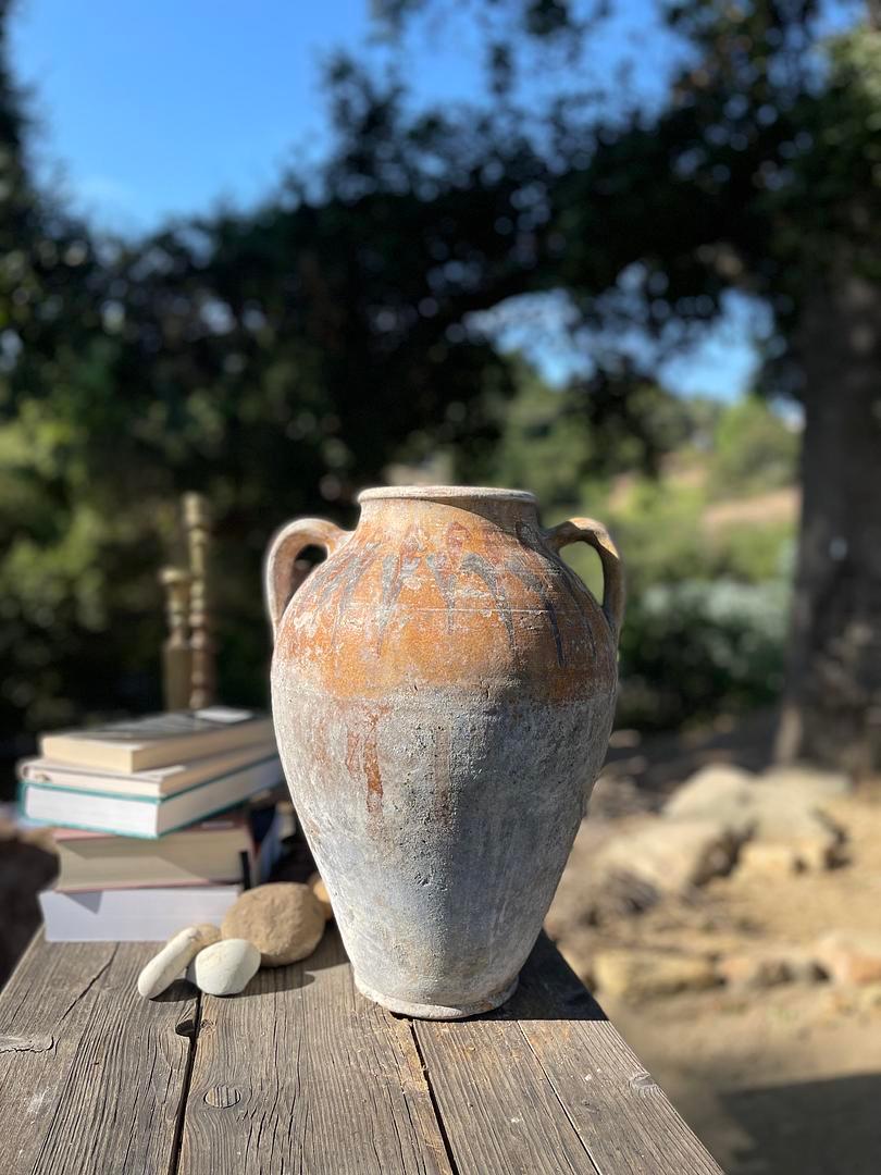 Kınık is a traditional Anatolian pottery technique that blends control and chance to create one-of-a-kind designs on the surface of each piece. This medium-sized Kınık Küpü was likely used to store or preserve goods, like pekmez, a thick