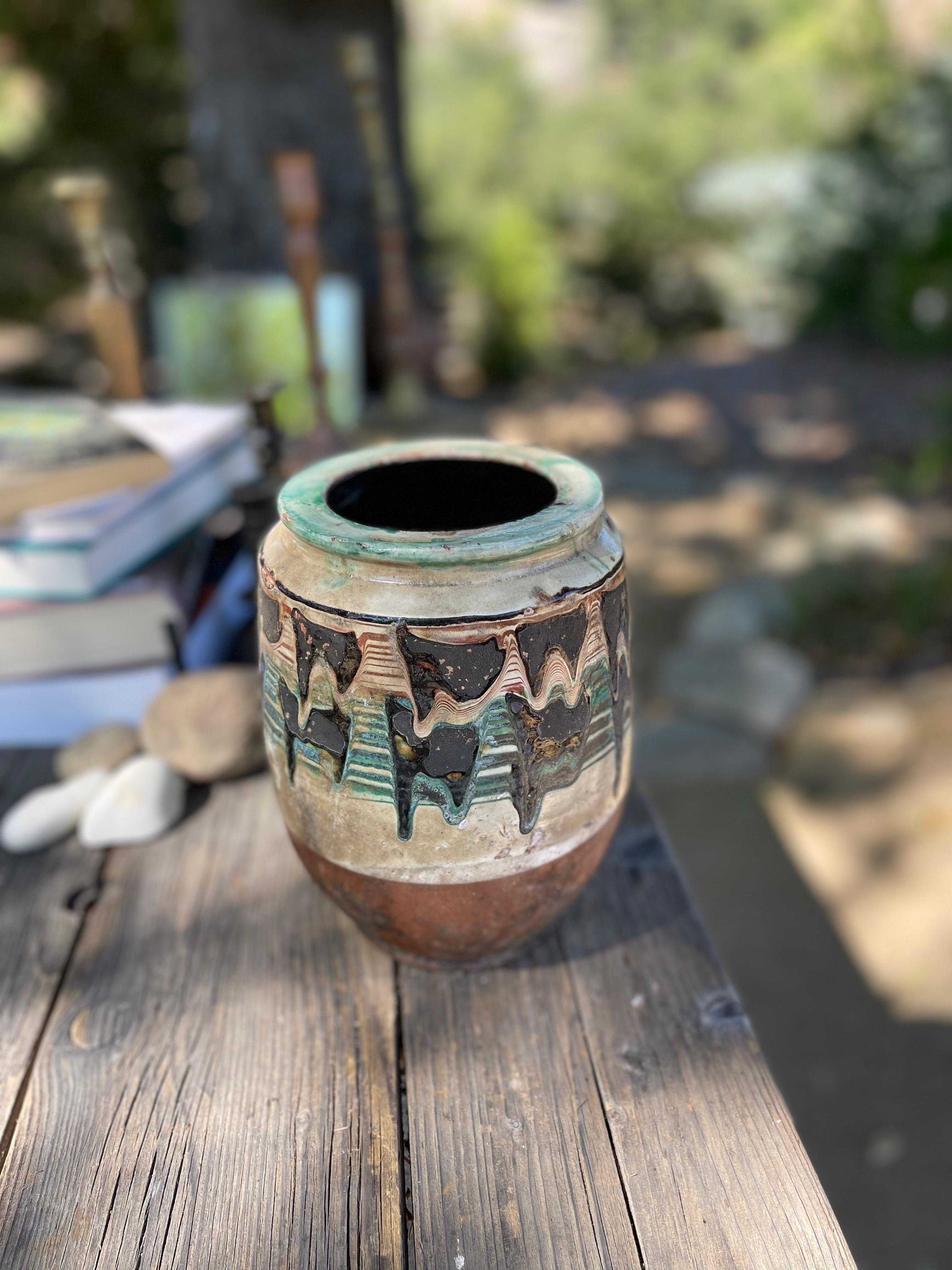 Kınık is a traditional Anatolian pottery technique that blends control and chance to create one-of-a-kind designs on the surface of each piece. Using an ox horn while the clay is still wet, the Kınık artist drips green, red, and black paint (derived