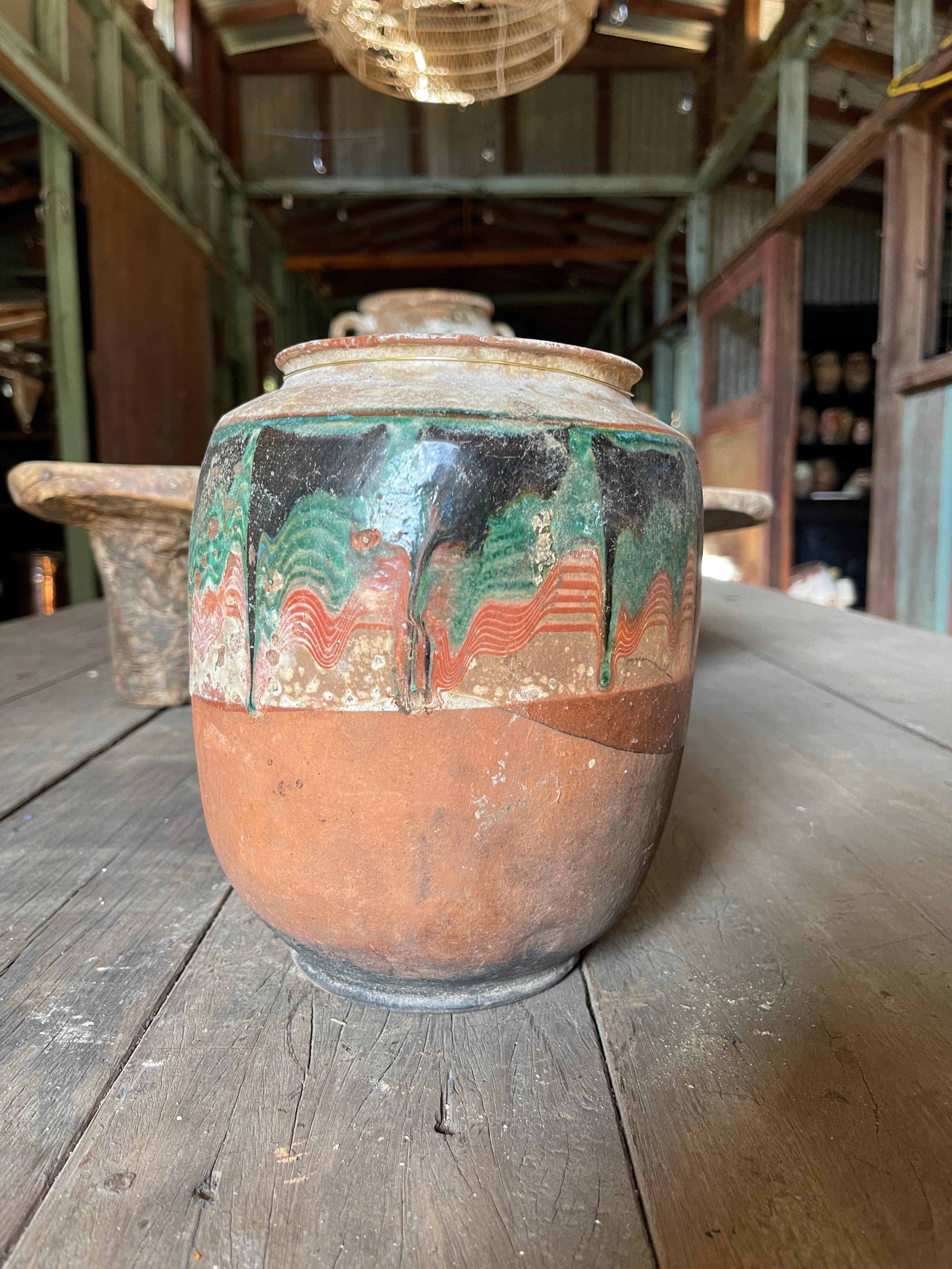 Kınık is a traditional Anatolian pottery technique that blends control and chance to create one-of-a-kind designs on the surface of each piece. Using an ox horn while the clay is still wet, the Kınık artist drips green, red, and black paint (derived