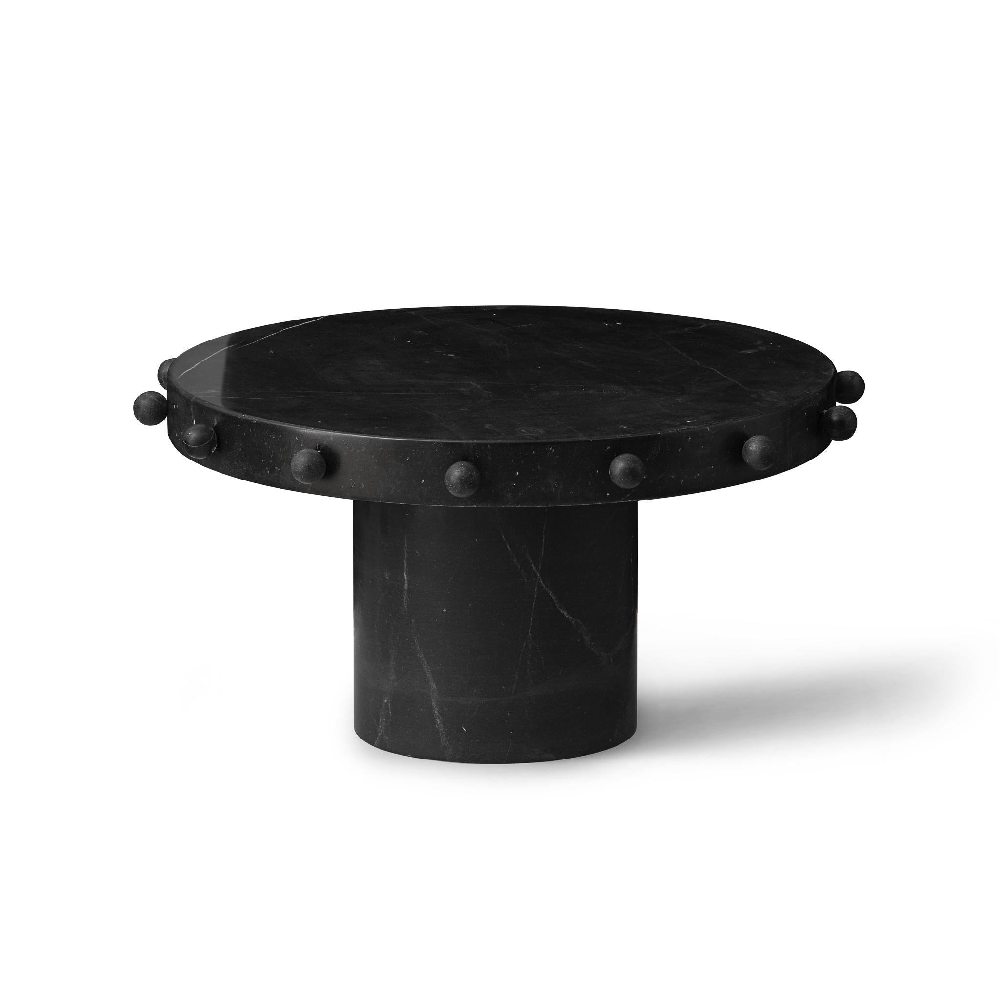The Knob Trio Tables are an exercise in aesthetic judo, manipulating the weight of Nero Marquina marble into forms that exude an almost casual lightness. Their honed surfaces, redolent of the ancient Mediterranean, speak to the grandeur of human