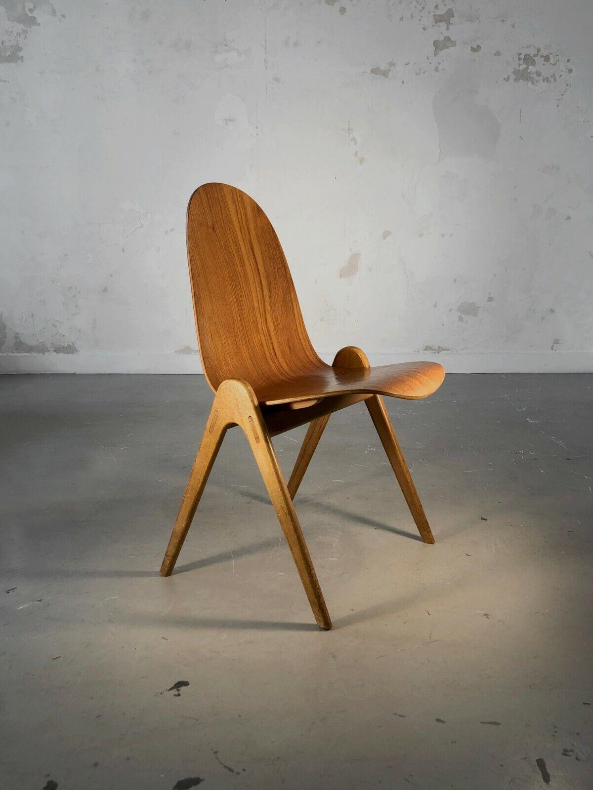 An amazing chair with compass feet and a Plywood back, Modernist, Forme Libre, Dansk, Scandinave, compass feet in birch wood, the seat in plywood held by two superb bronze nuts and bolts, model called 