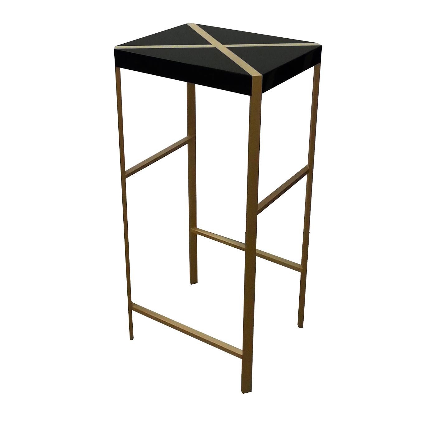 This striking stool complements any of the pieces in the Metaphysics collection. Its legs are in brass and the wood top, decorated with a diagonal brass cross, is finished with a hand-applied premium resistant lacquer, for a Minimalist, elegant look.