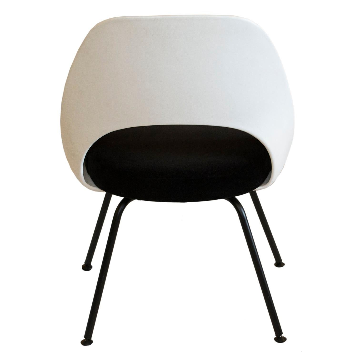 This Eero Saarinen for Knoll plastic-back side chair was reupholstered in black cotton velvet fabric. Perfect for a kitchen, as a desk chair, or a single chair in any room of the house. You can also create your own set from our unique offerings of