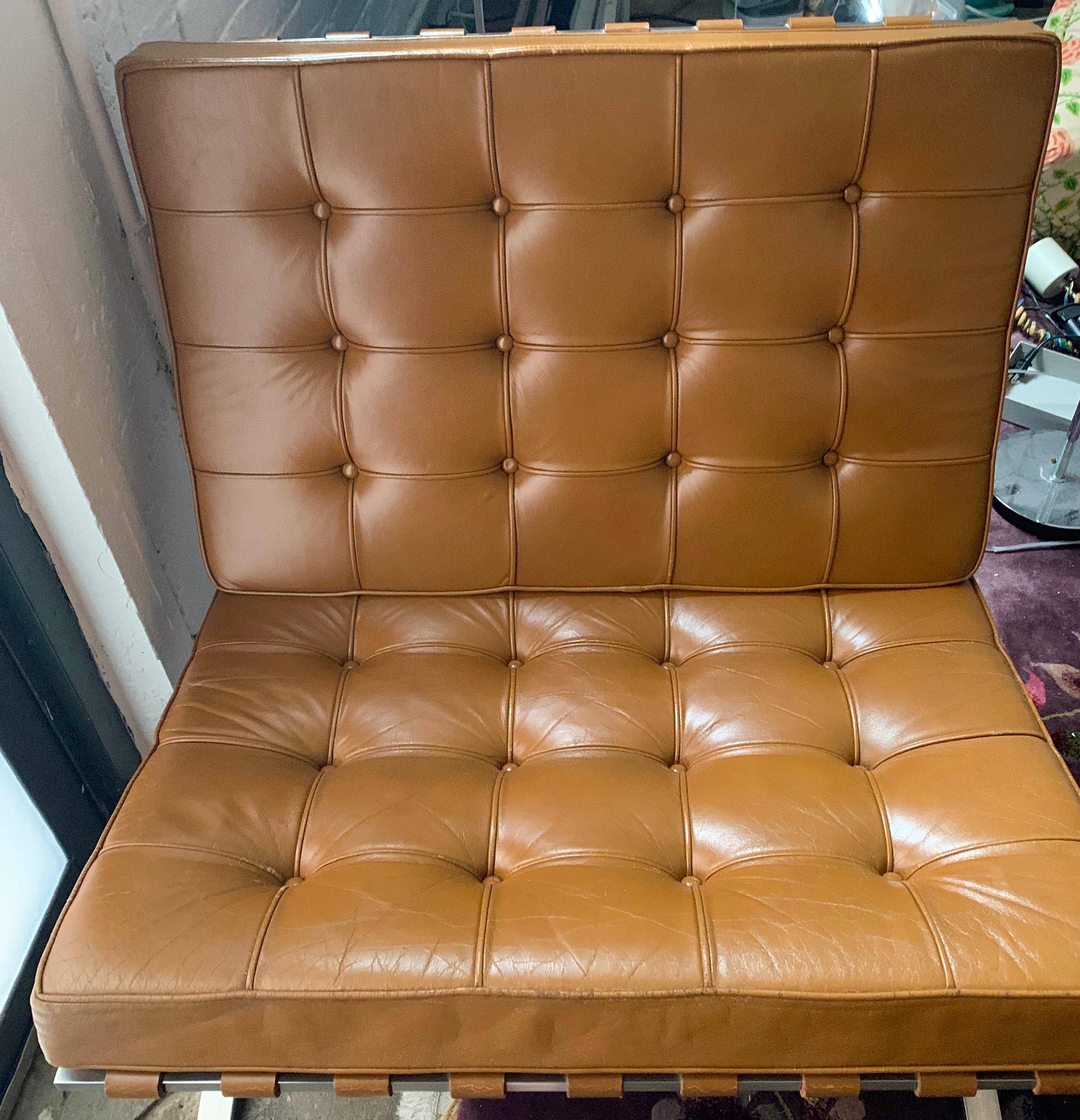 Knoll Barcelona lounge chair, stainless steel, Mies van der Rohe, circa 1961. Deep chestnut brown original leather, straps in-tact, highly sought after original stainless steel frame. Label intact on one chair - see photos. Knoll Park Ave address on