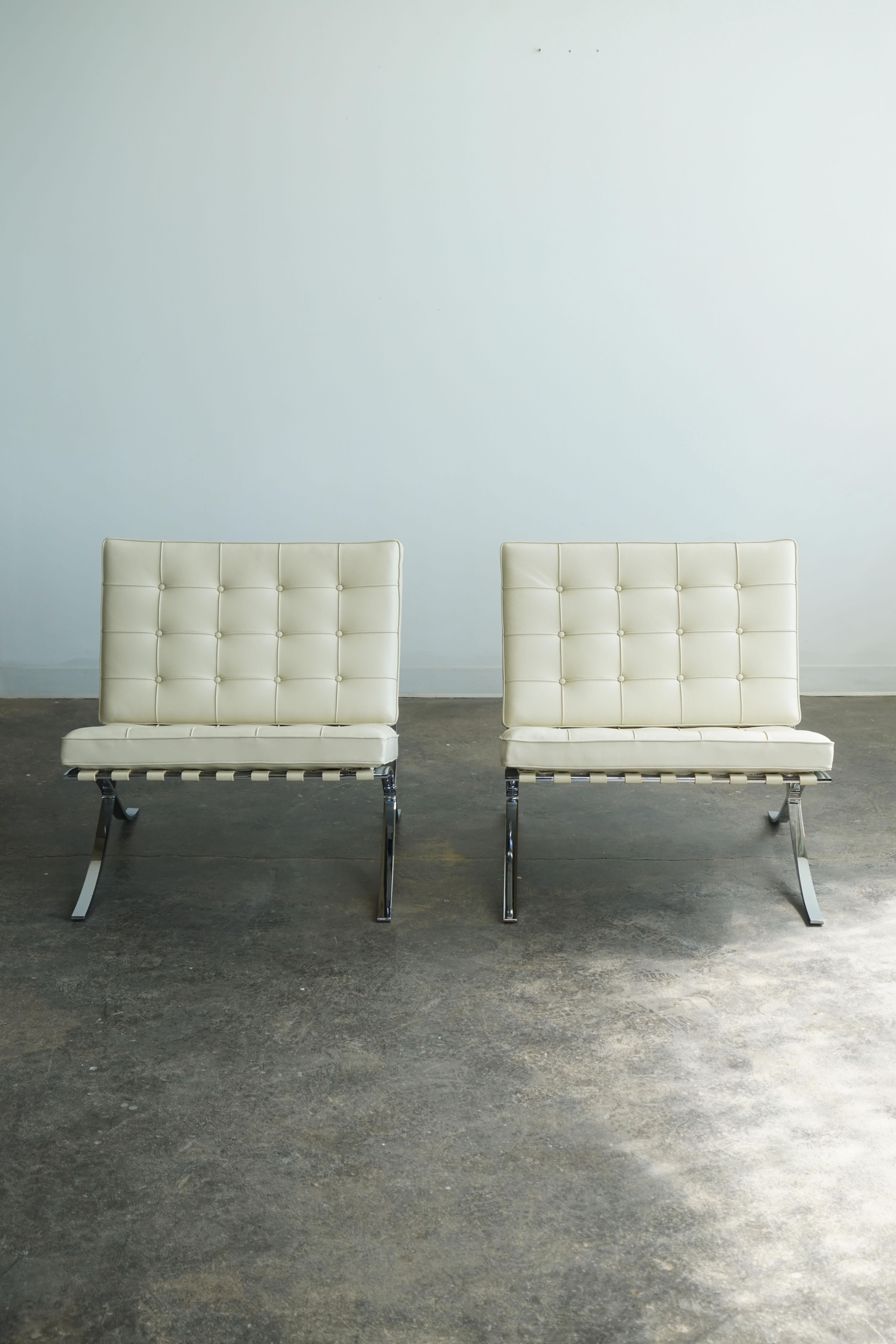 Knoll Barcelona Chairs, set of 2.
Designed by Mies van der Rohe, originally in 1929.  
Volo 