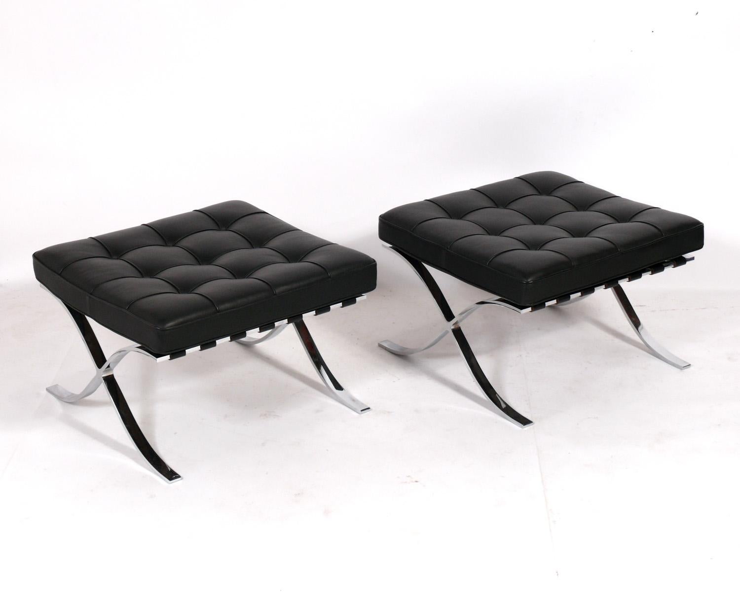 Iconic Pair of Barcelona stools or ottomans, designed by Mies van der Rohe for Knoll, American, circa 2000s. Retains Knoll tag underneath. They have been cleaned and a leather conditioner applied. Why pay $3000 or more for each new?.