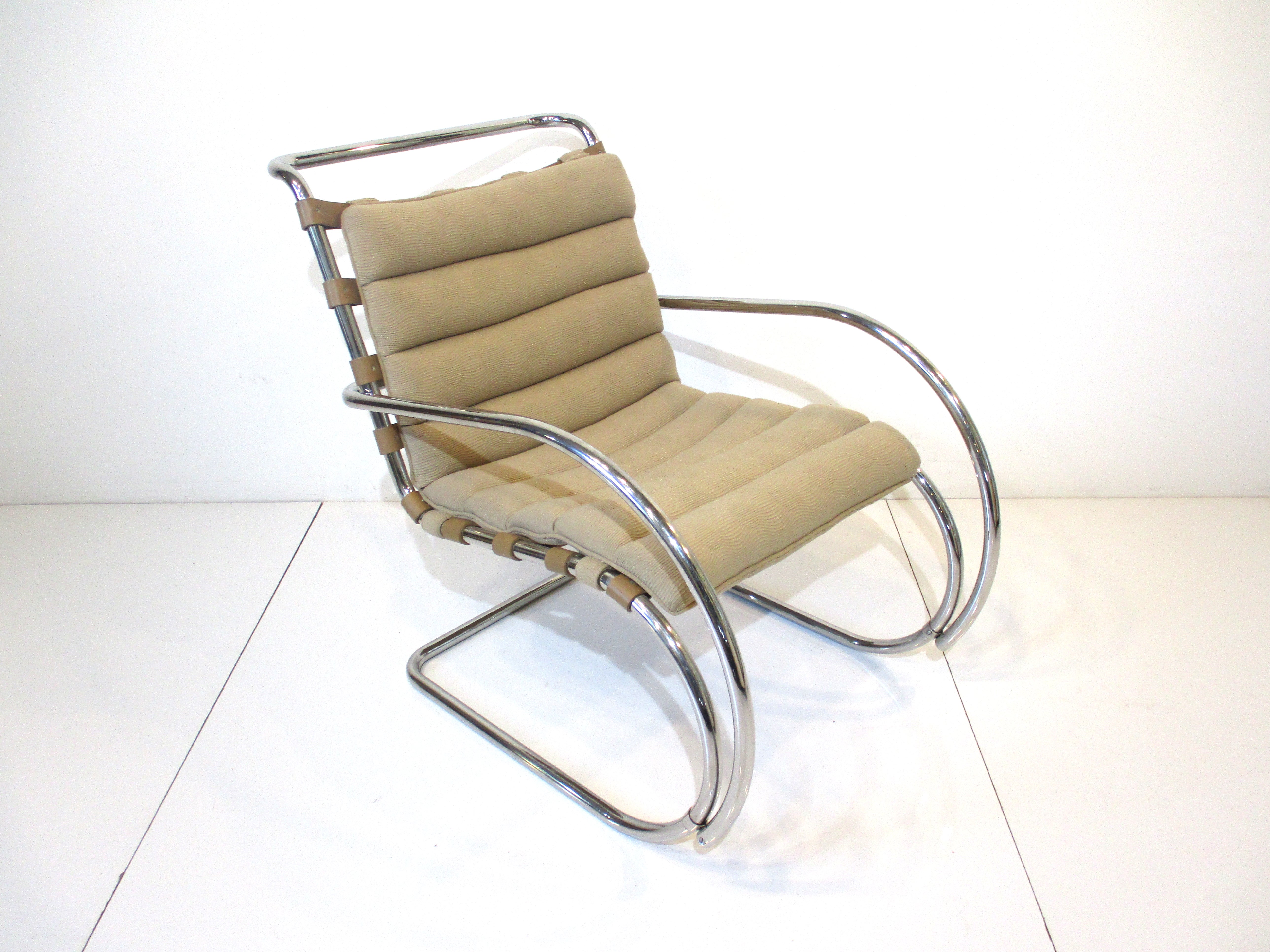 A very well made and comfortable sculptural chromed steel framed lounge chair with thick leather support strapping and rolled upholstered seat . Manufactured by Knoll International model MR Beaver chair .