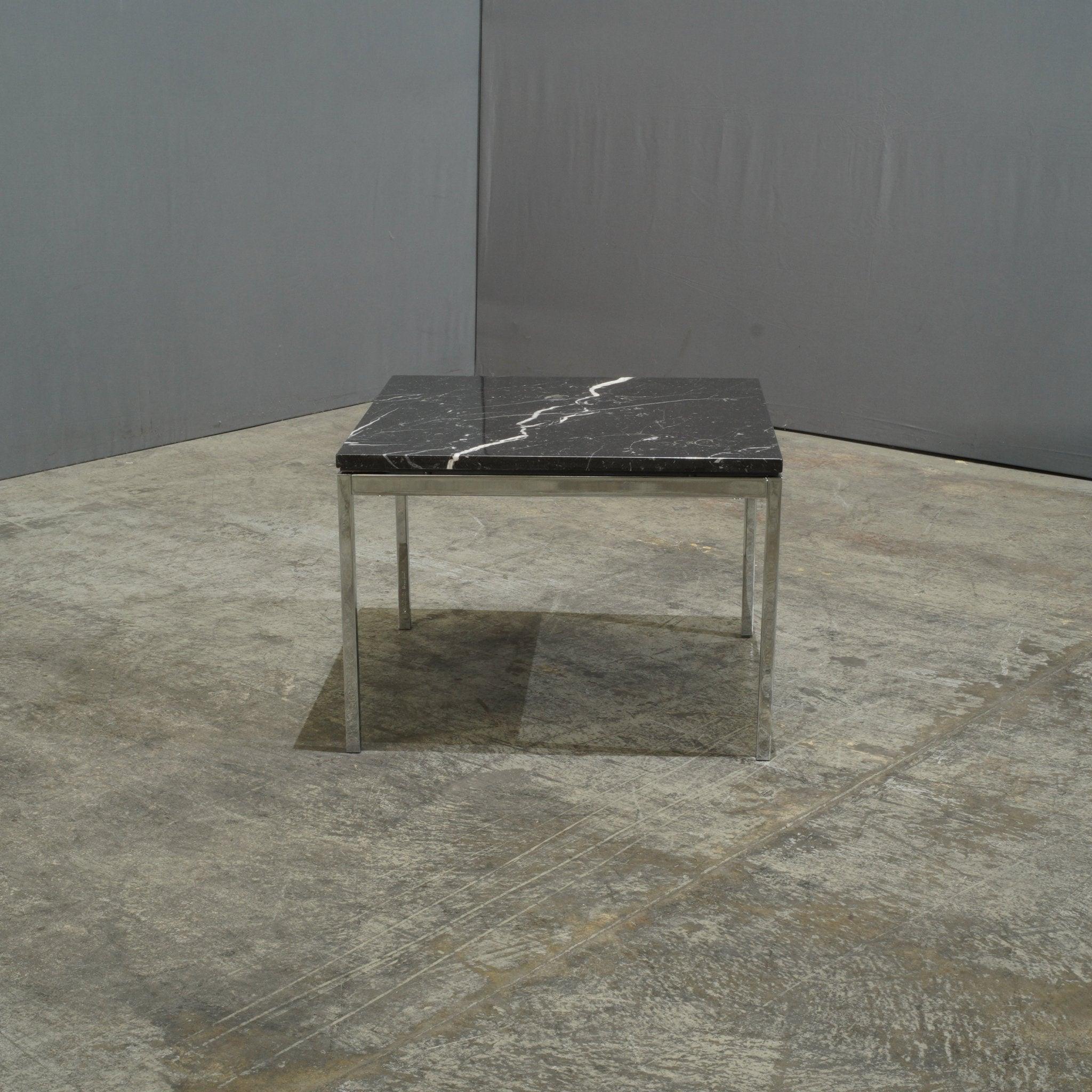 A striking centerpiece for the contemporary living space, the Knoll Florence Knoll Black Marble Coffee Table exudes sophisticated minimalism.  This architecturally inspired table features a sleek square top crafted from luxurious black marble. The