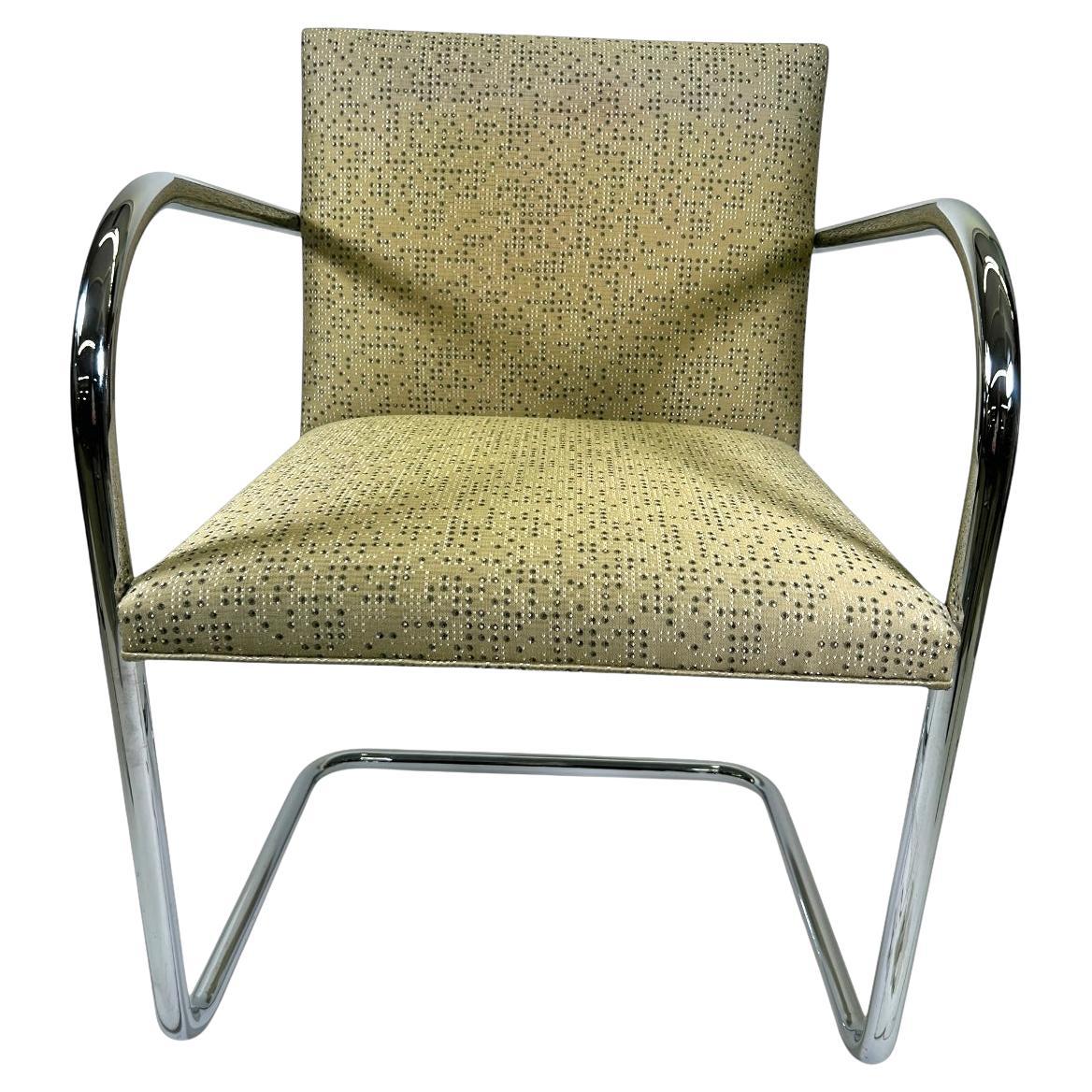Knoll Chrome Tubular Chair by Ludwig Mies van der Rohe. These Brno armchairs celebrate the classic tubular design of Ludwig Mies van der Rohe, crafted by Knoll. They are upholstered in pale gold geometric pattern that has a gorgeous vintage