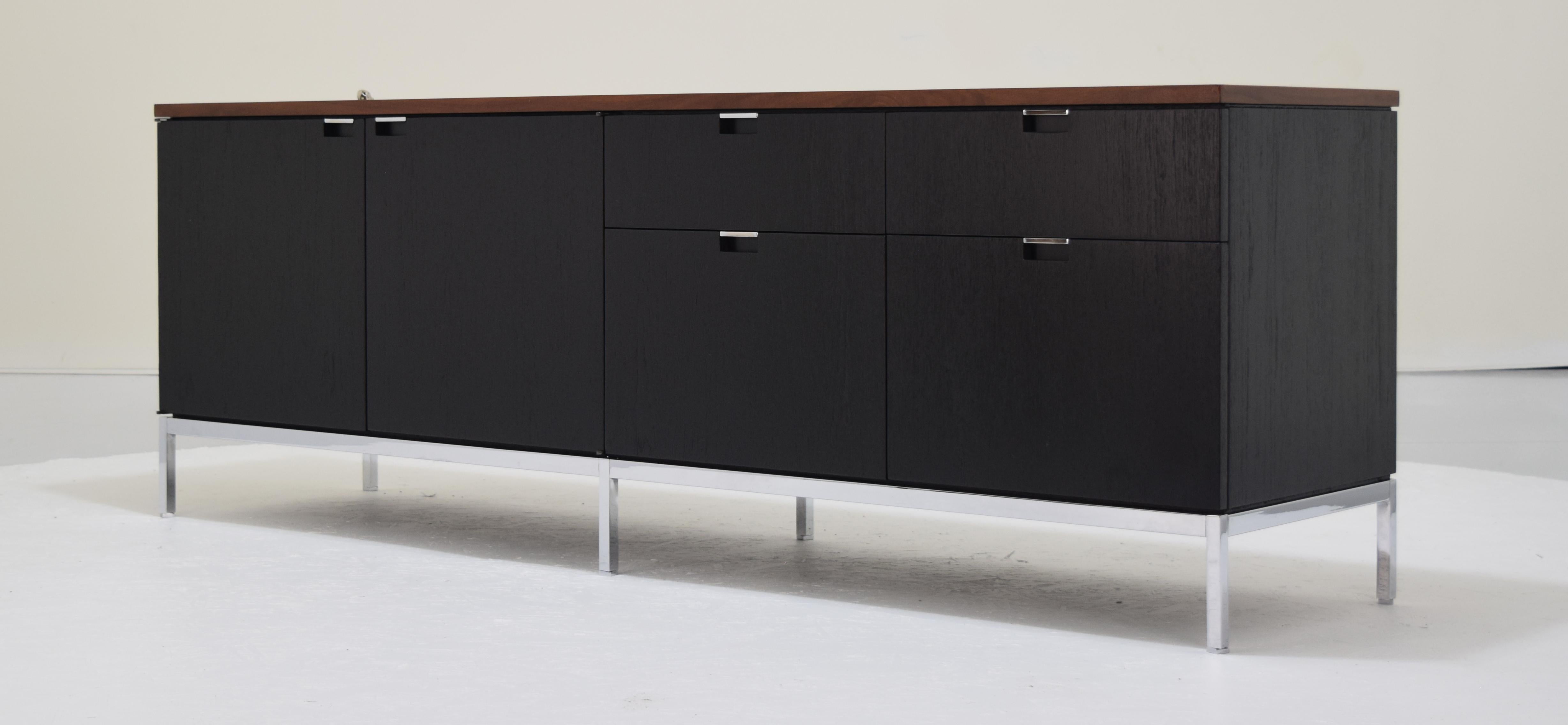 An sleek, elegant Knoll executive credenza in ebonized wood with rare rosewood top. Designed by Florence Knoll in 1961 and manufactured by Knoll International. There are two of these credenzas available, this listing is for one. 

Measures: 74.5 x