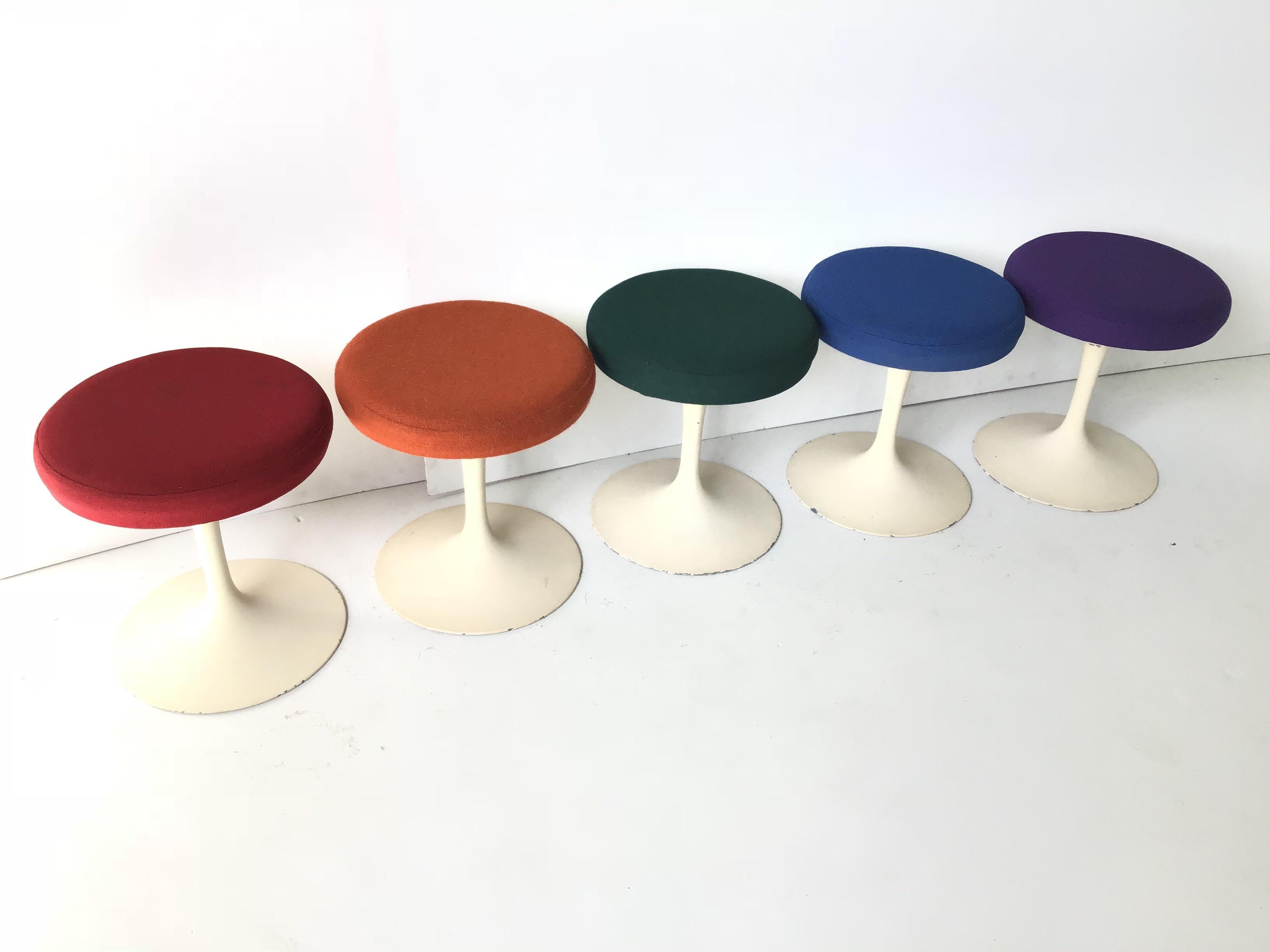 This is an amazing all original vintage set of Knoll tulip stools designed by Saarinen. They all retain their original fabric in five different colors pictured. The bases have not been repainted but are all original and show many knicks to paint.