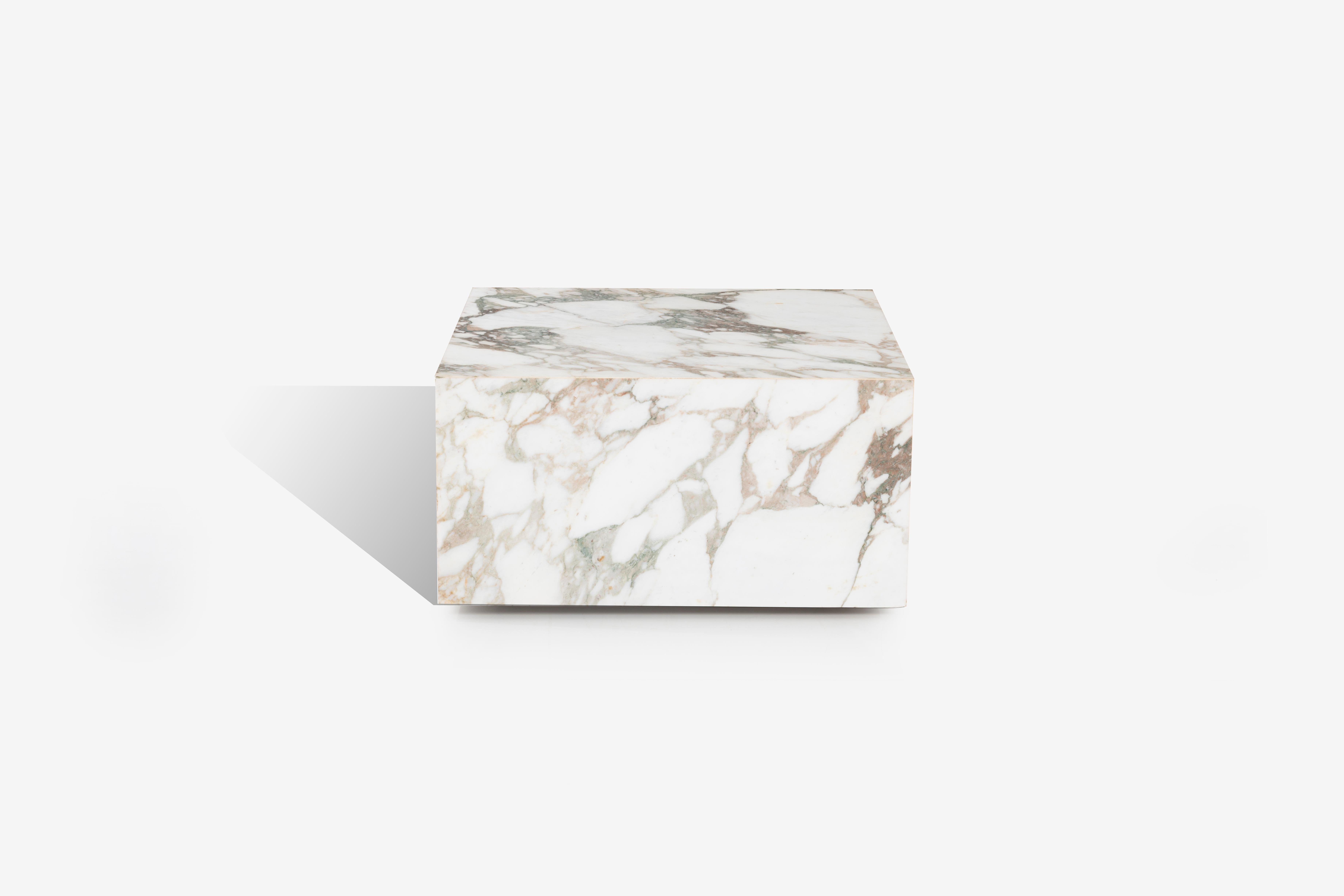 Knoll Gae Aulenti style Calacatta cube coffee table, solid marble cube appearance, constructed with marble supports on underside with hidden wheels for easy placement and clean reveal appliance.