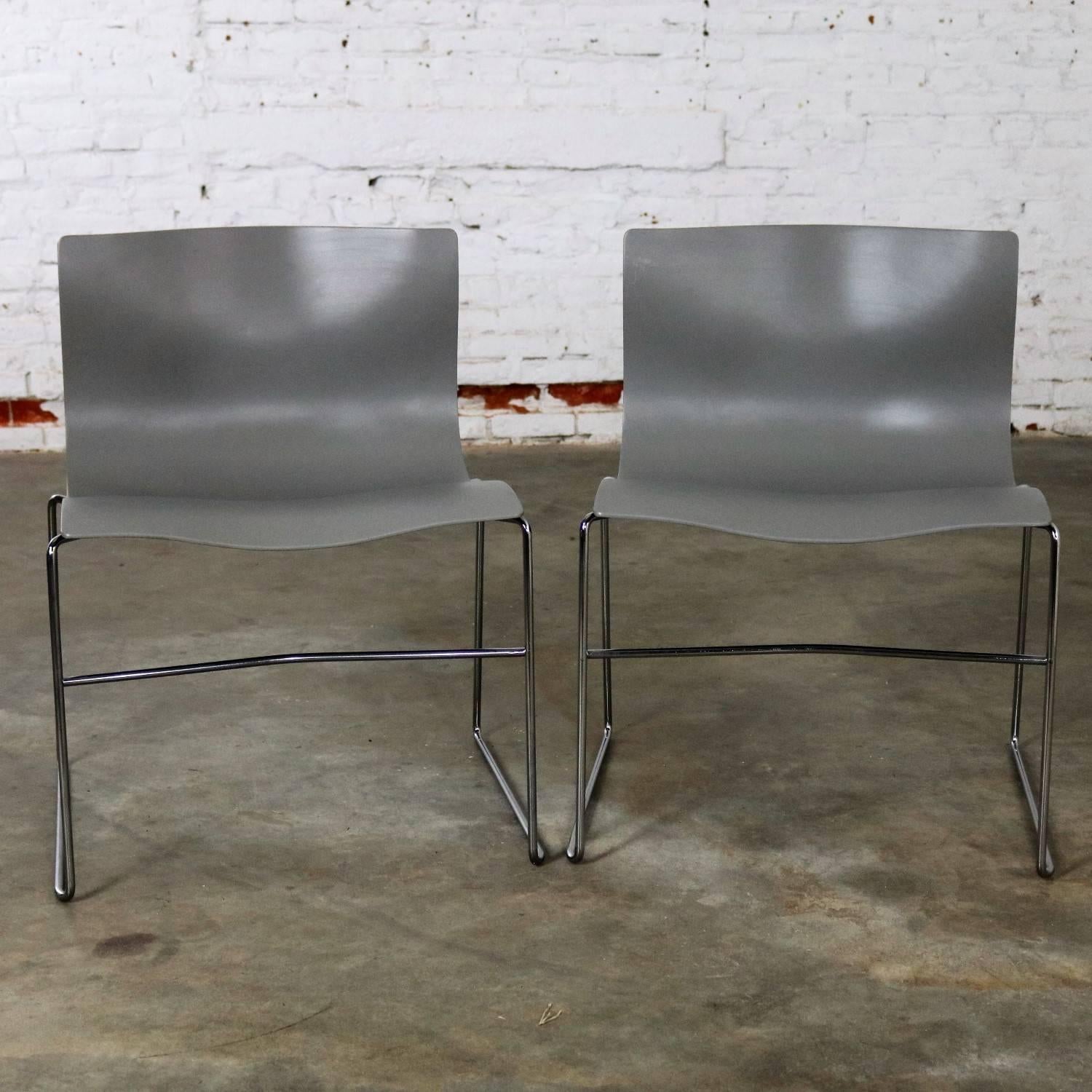 Handsome pair of Knoll handkerchief side chairs in gray with chromed steel wire base. This chair was designed by the husband and wife team of Massimo and Lella Vignelli for Knoll, circa 1985. They are in excellent condition and what I would consider